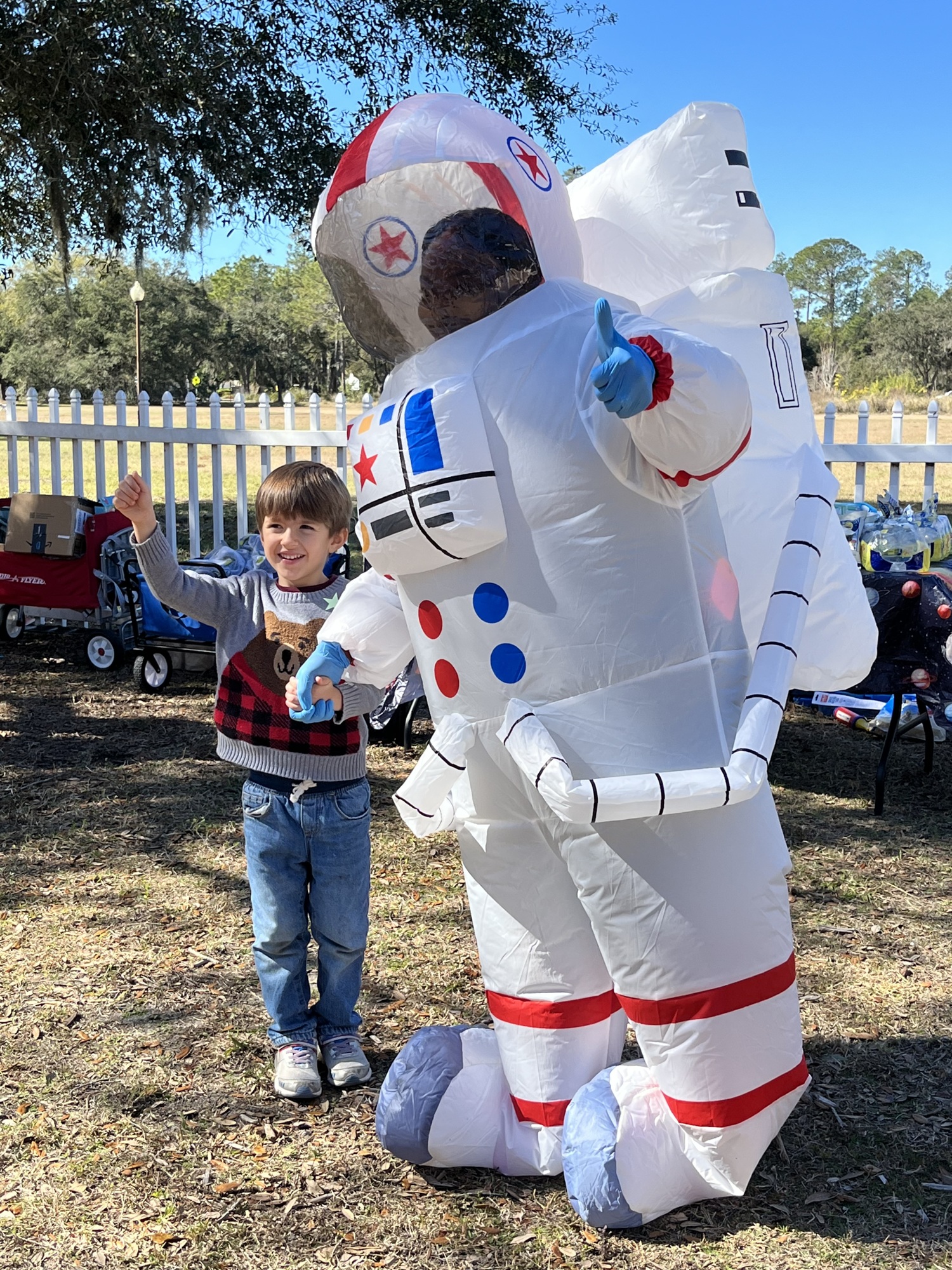 Liam Manley, who is 5, says hello to Shenicka Claxton dressed as an astronaut.