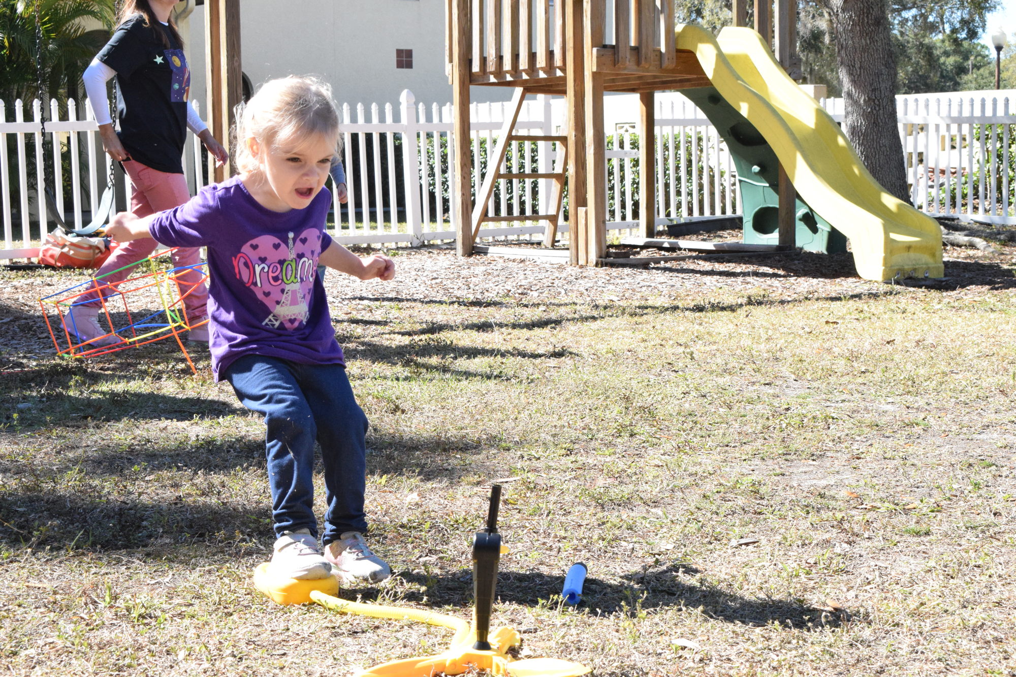 Lakewood Ranch's Kali Hill, who is 4, launches a toy rocket into the air.
