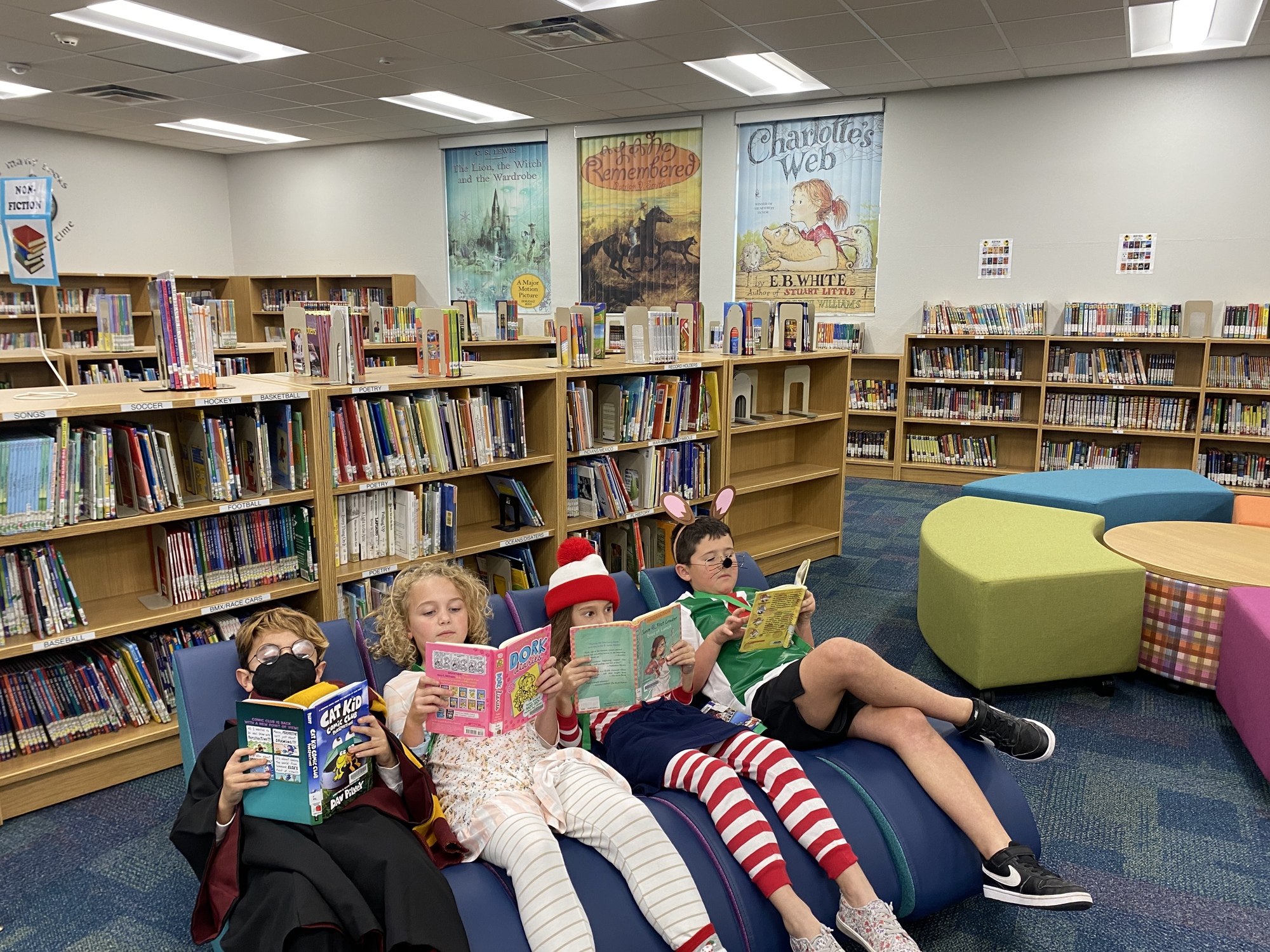Gene Witt Elementary School students Jack Laubacker, Juliana  Grosso, Lily Fouche and Logan Morton read while resting in a rocker, which is one of the flexible seating options. Courtesy photo.