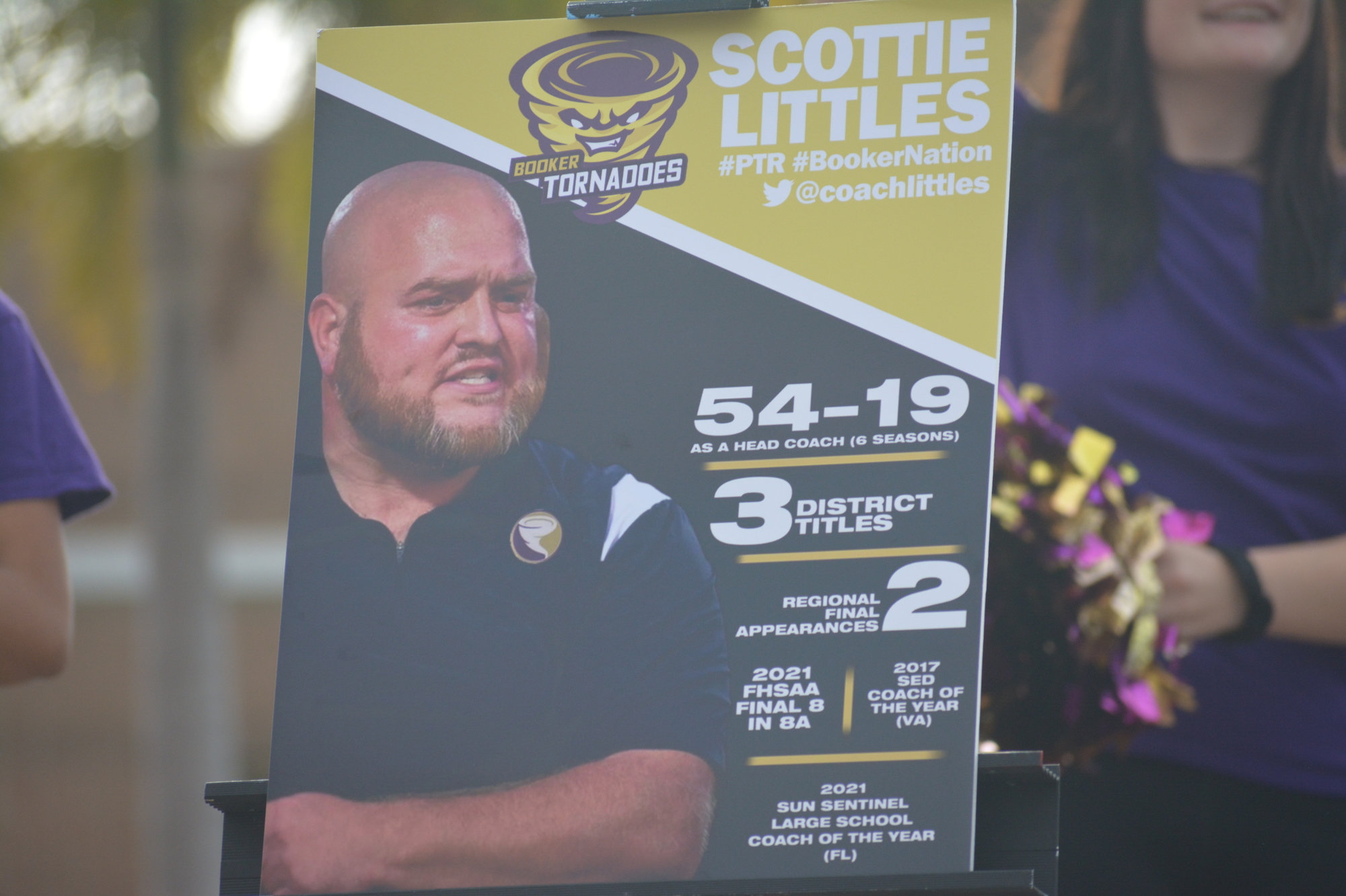 A poster celebrating Scottie Littles' accomplishments was present at Littles' introductory press conference.