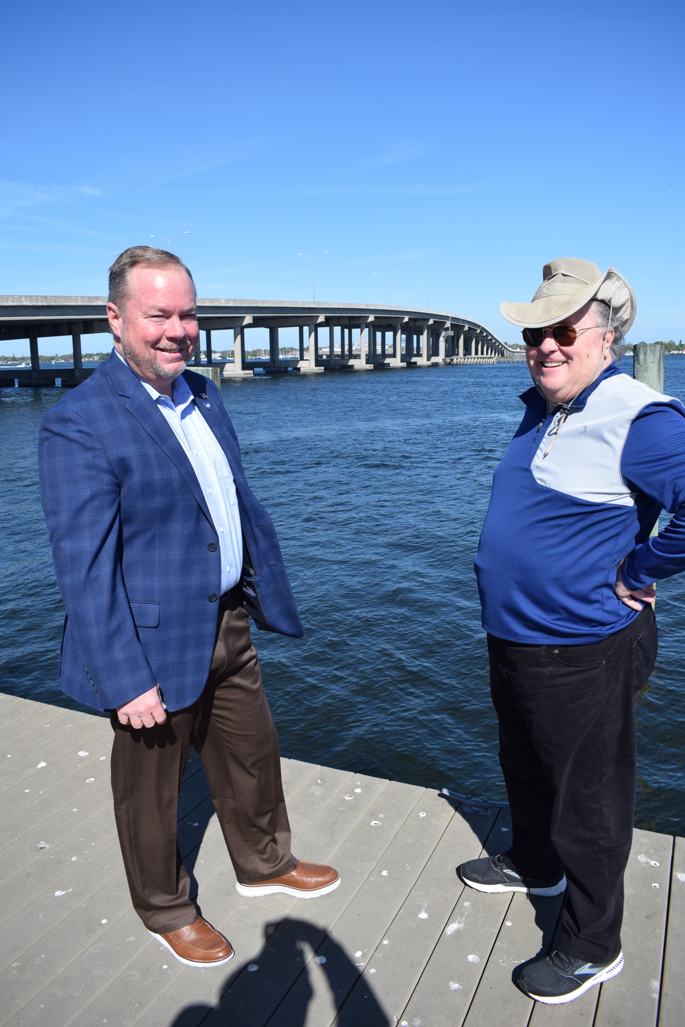 Mayor Gene Brown and Mike Fetchko talk about the Bradenton Area River Regatta with the Green Bridge in the background.