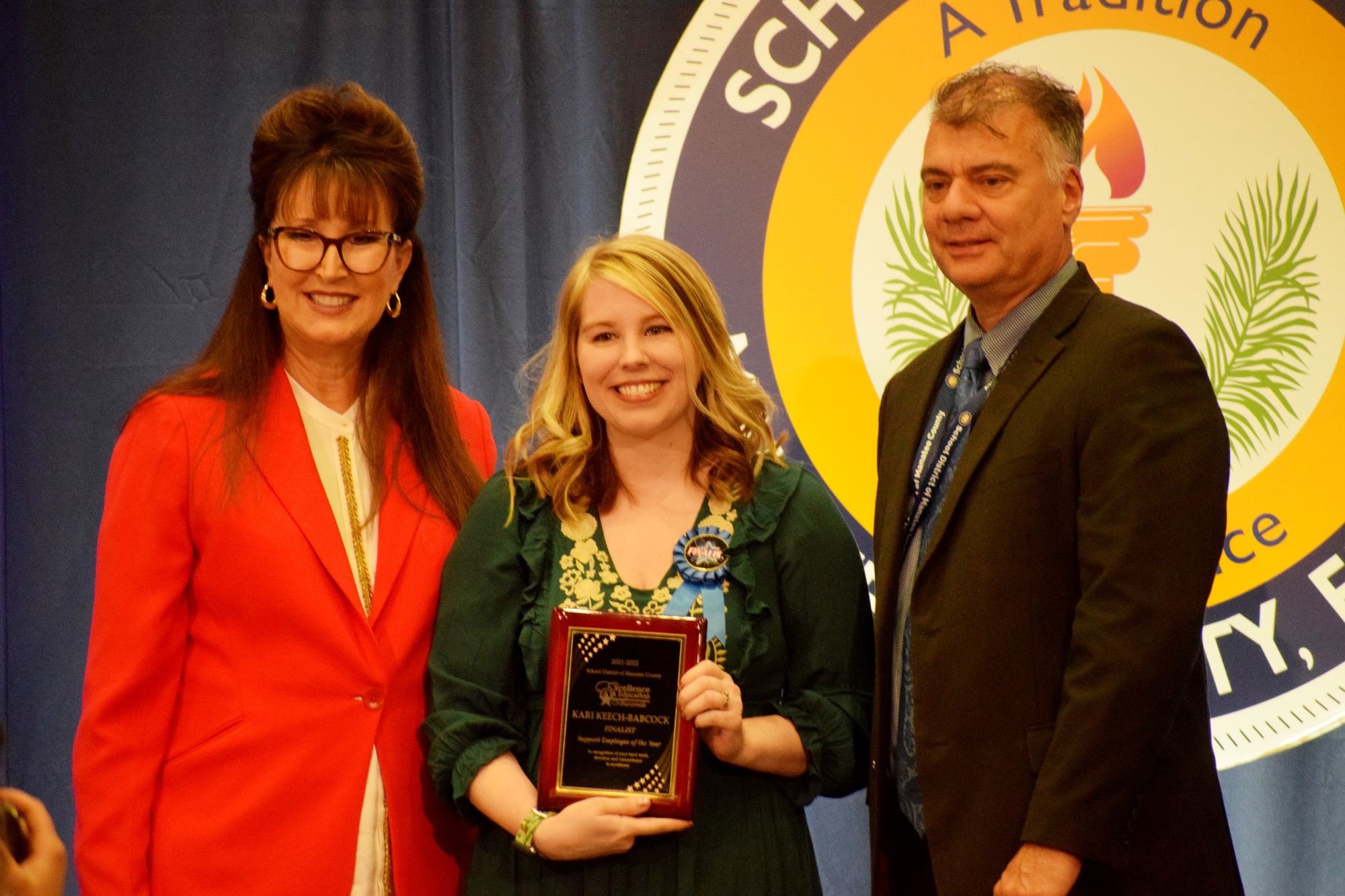 School District of Manatee County's Superintendent Cynthia Saunders and Doug Wagner presents Kari Keech-Babcock (center), a guidance clerk at Lakewood Ranch High, with a plaque for being a Support Employee of the Year finalist.