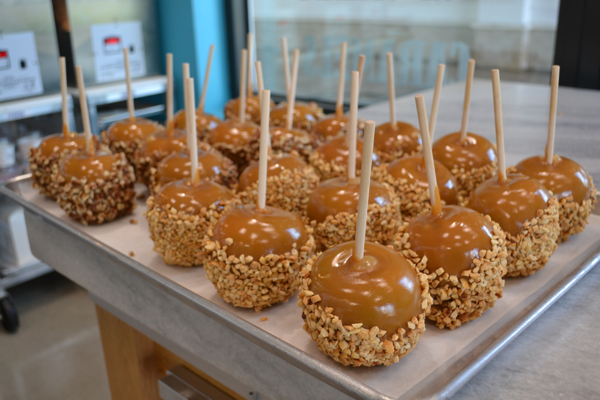 A tray of caramel apples stands ready to entice customers.