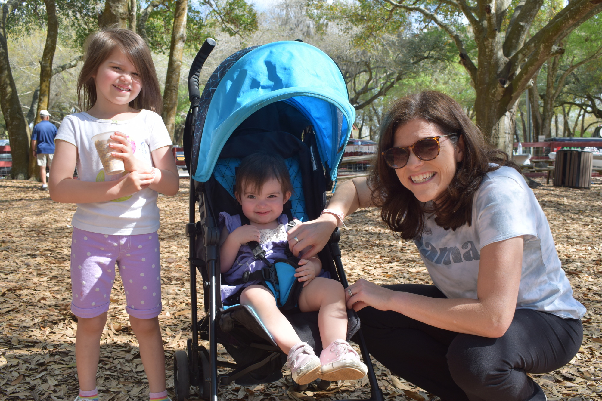 Sarasota's Charlotte Detwiler, who is 4, gets ready to feed animals with her 1-year-old sister, Emery Detwiler, and her mother, Laura Detwiler.