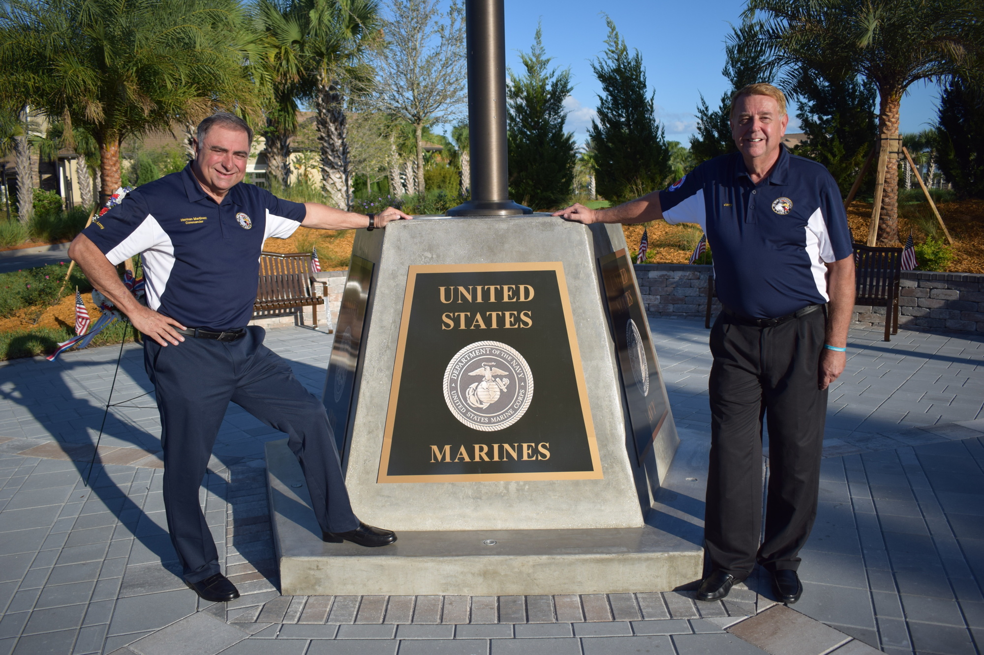 Herman Martinez and Jerry Hufford pose next to the Circle of Honor memorial at Del Webb that the Association of Veterans and Military Supporters helped create with Pulte, the Del Webb builder.