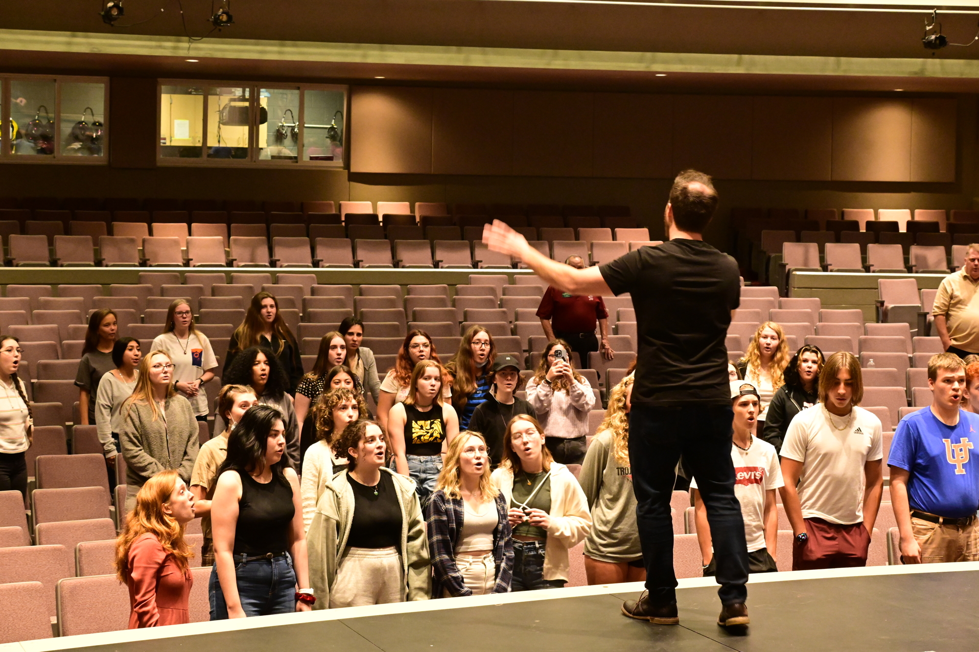 Jonny Moroni of Vocal Spectrum leads the Riverview students in a singing exercise. (Photo: Spencer Fordin)