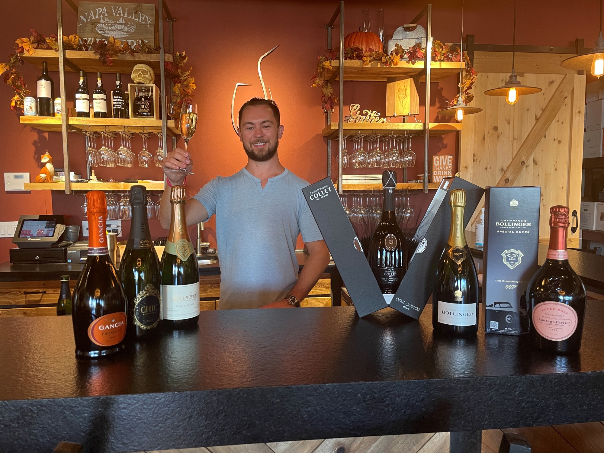 Scott Shortt, the owner of Fine Wine & Tastings on Main, with his favorite Champagnes and sparkling wines.