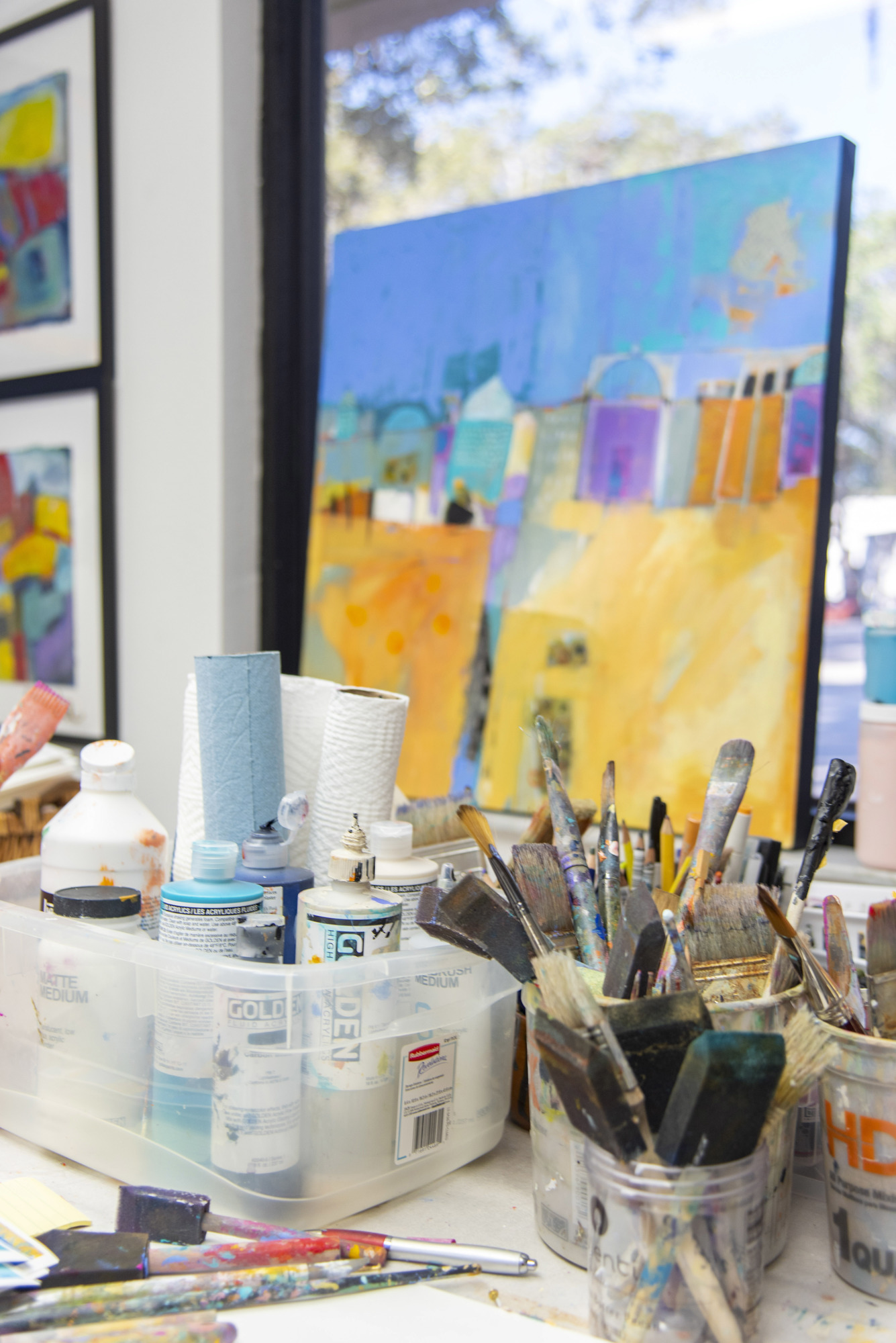 Liz Cole shares a studio with two other artists. She says that painting is vital to her life.  (Photo by Lori Sax )