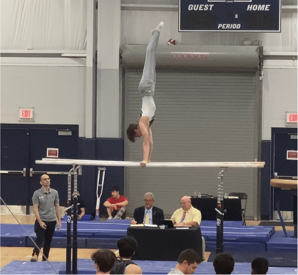 Jaden Blank performs on the parallel bars during the  2022 Florida Men's State Championships. Courtesy photo.