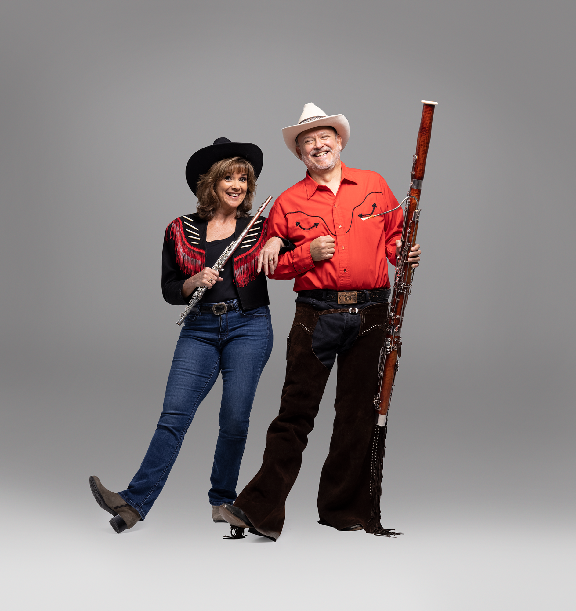 Betsy Hudson Traba and Fernando Traba are in character and ready to play along with the Sarasota Orchestra in their exploration of Western motifs. (Courtesy photo)