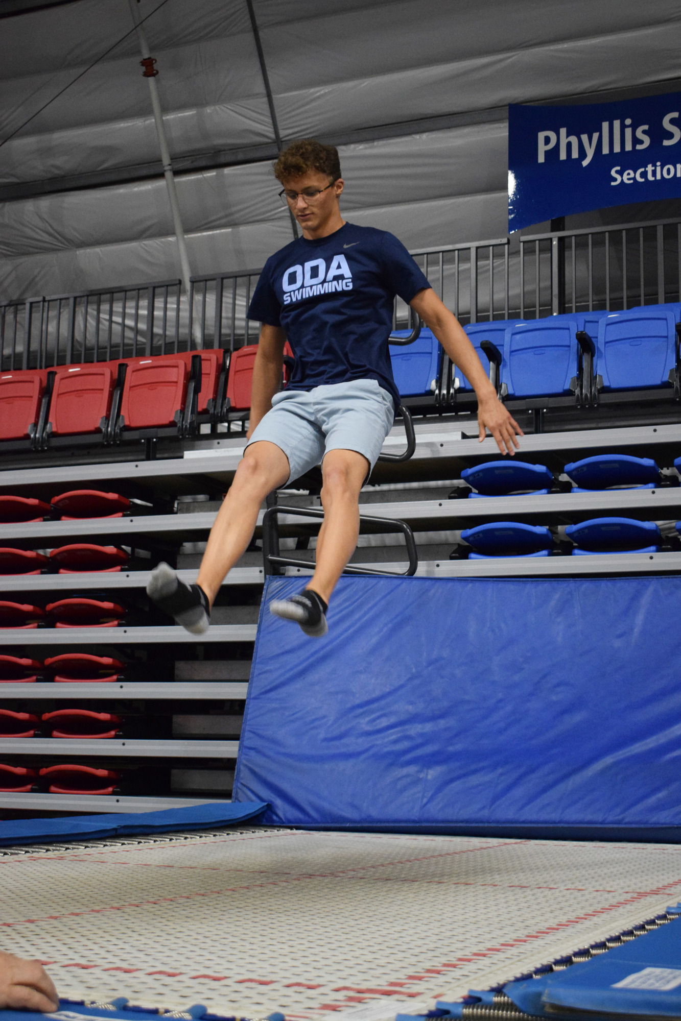 Junior Felipe Baffico practices different jumps on a trampoline.