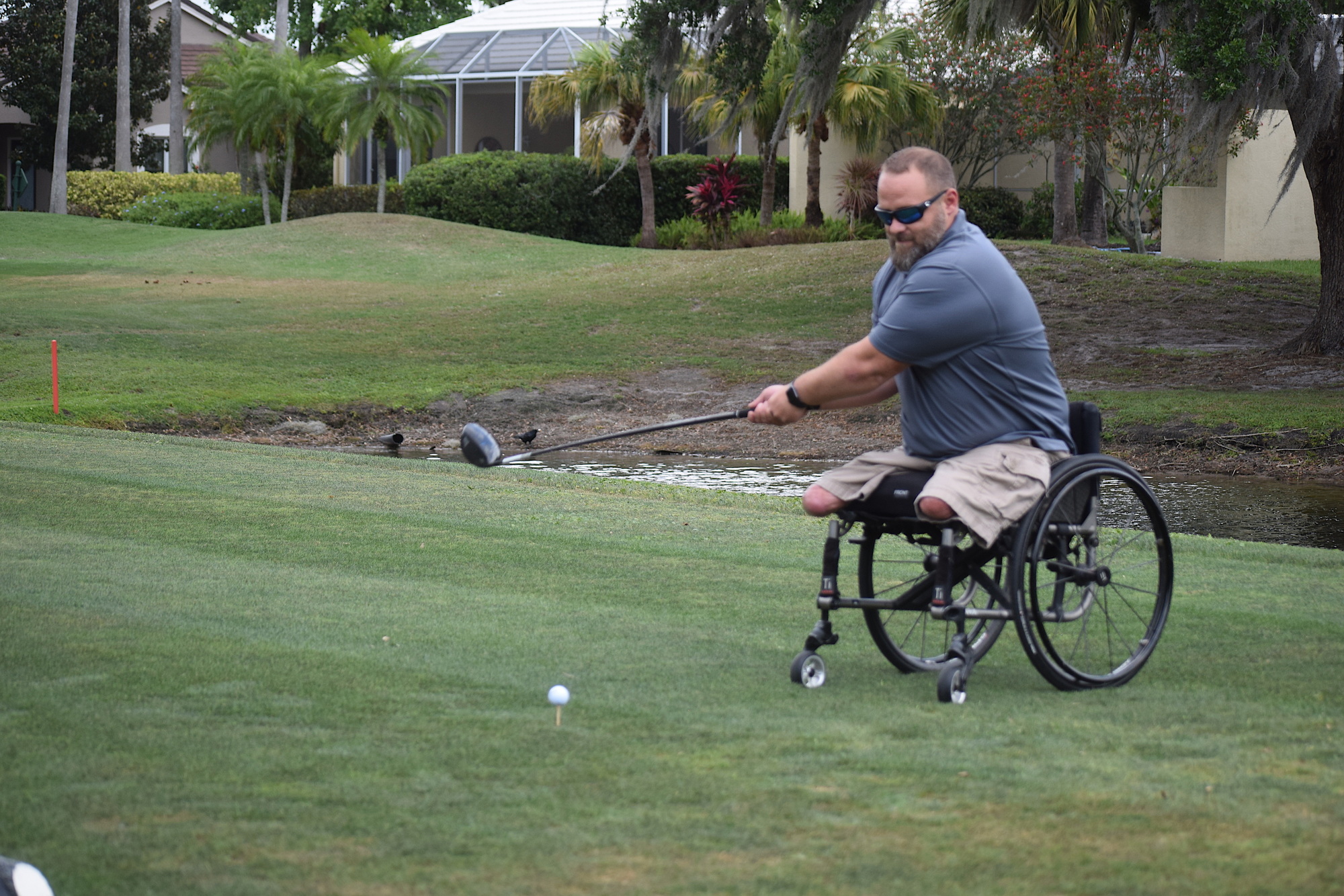 Army Sergeant Chad Rozanski, who was injured in Iraq in 2006, takes a swipe at a golf ball during the Rosedale Golf Classic.