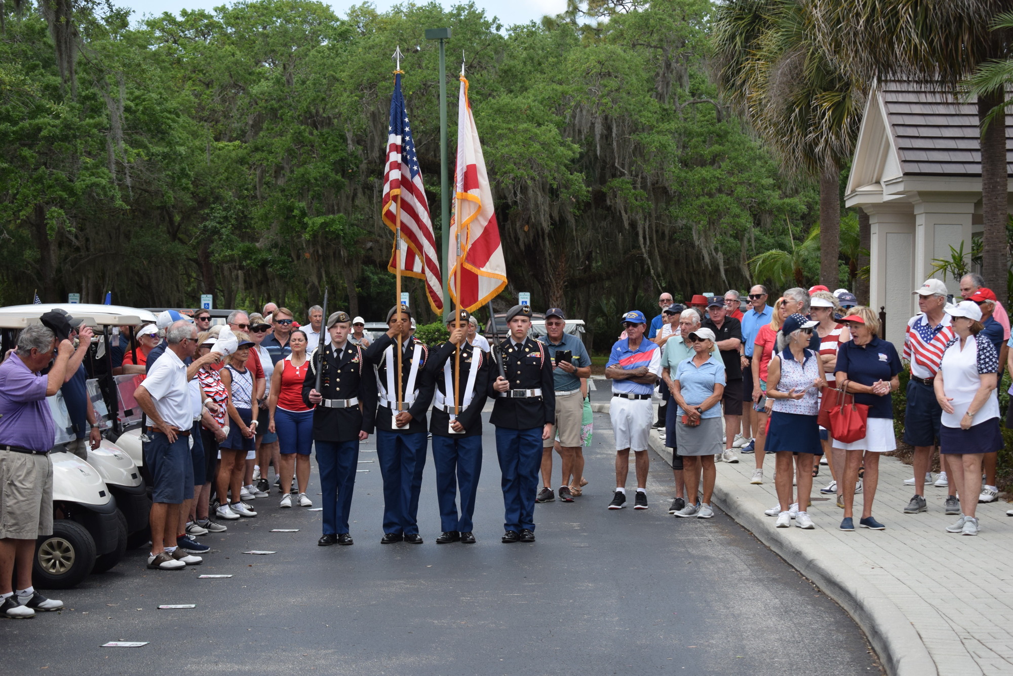 Sarasota Military Academy seniors William Ries and Sebastian Katra and juniors Raphael Fabyanic and Andrew Harvey present the colors to kick off the ceremony.