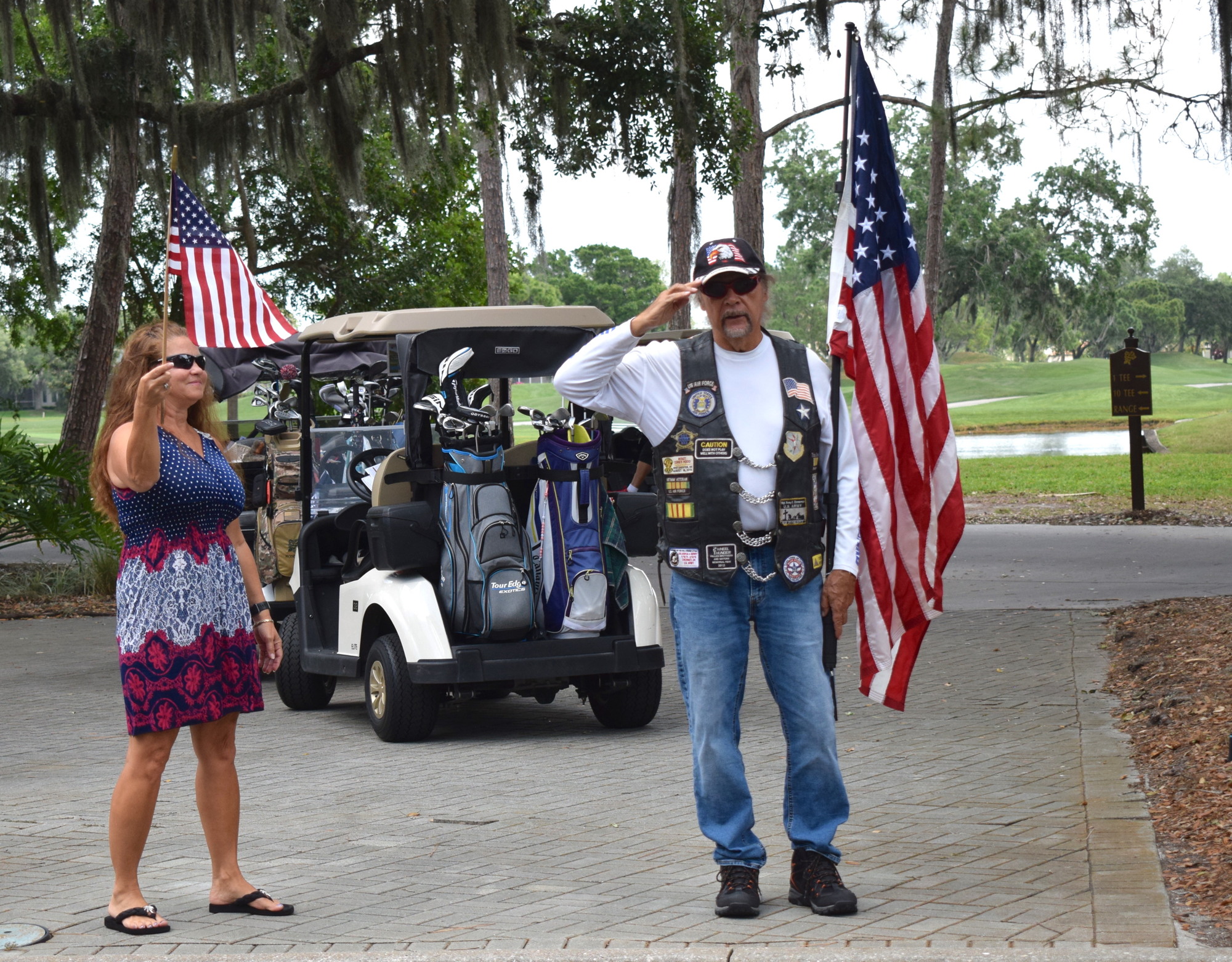 Lakewood Ranch's Tammy Young and John Emmons, representing the Patriot Guard Riders, salute the veterans.