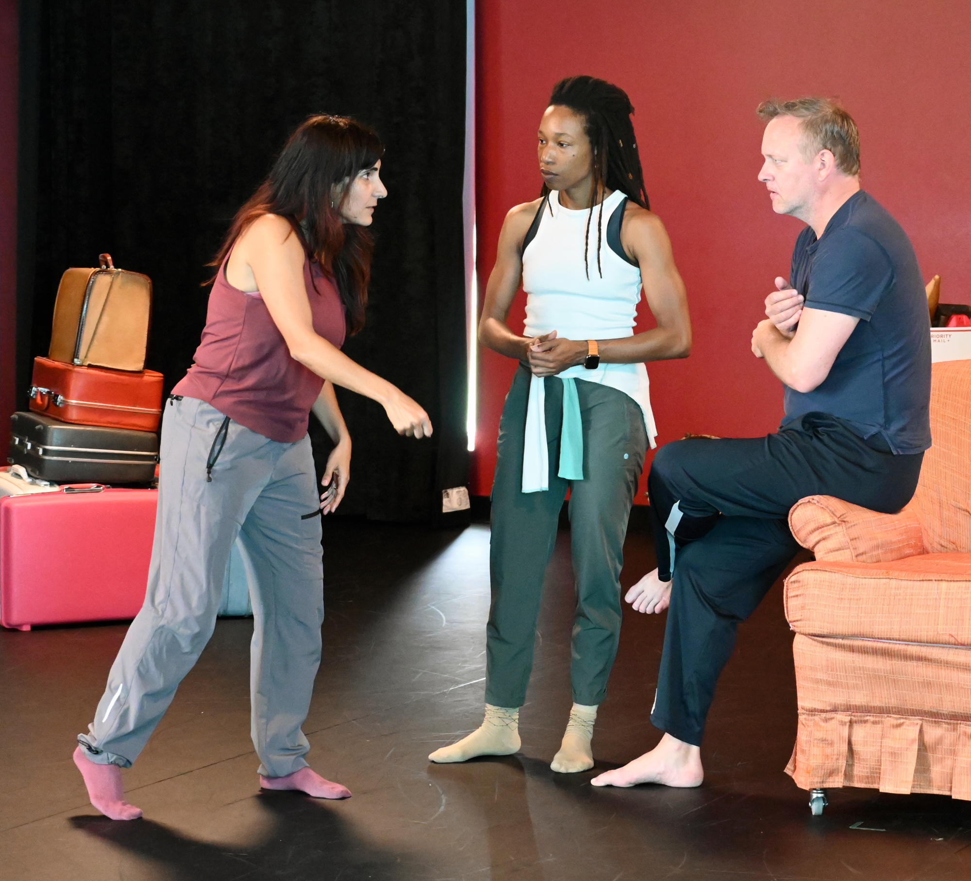 Leymis Bolaños Wilmott instructs dancers Michael Foley and Monessa Salley at rehearsal.