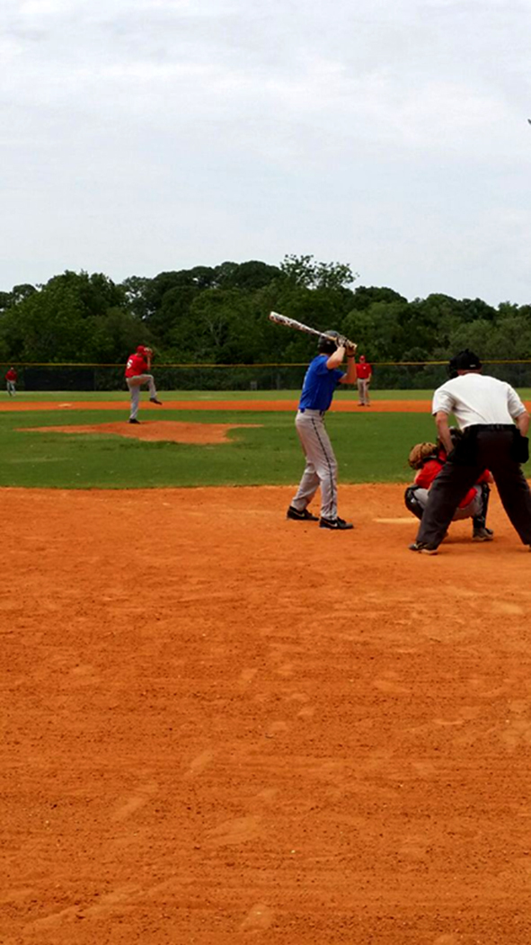 Jermey Metters stands behind the plate for a game involving his two sons, Codey Metters (pitching) and Kyle Metters (catching). Jermey Metters said even when his sons were playing, his only goal was to call a consistent game.