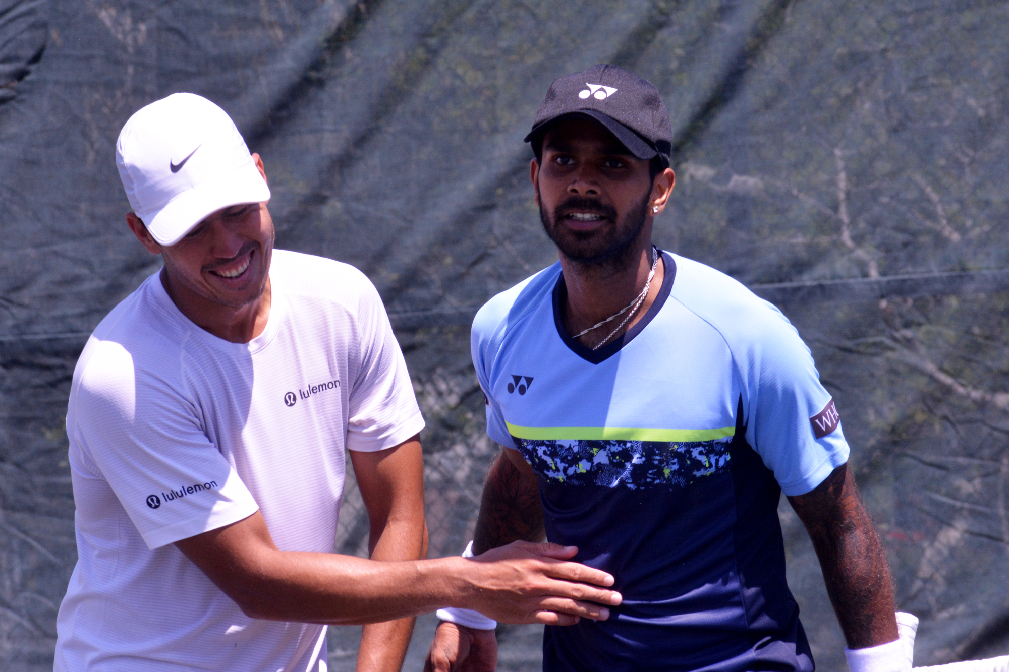 Jason Kubler and Sumit Nagal share a moment after their match at the Sarasota Open.