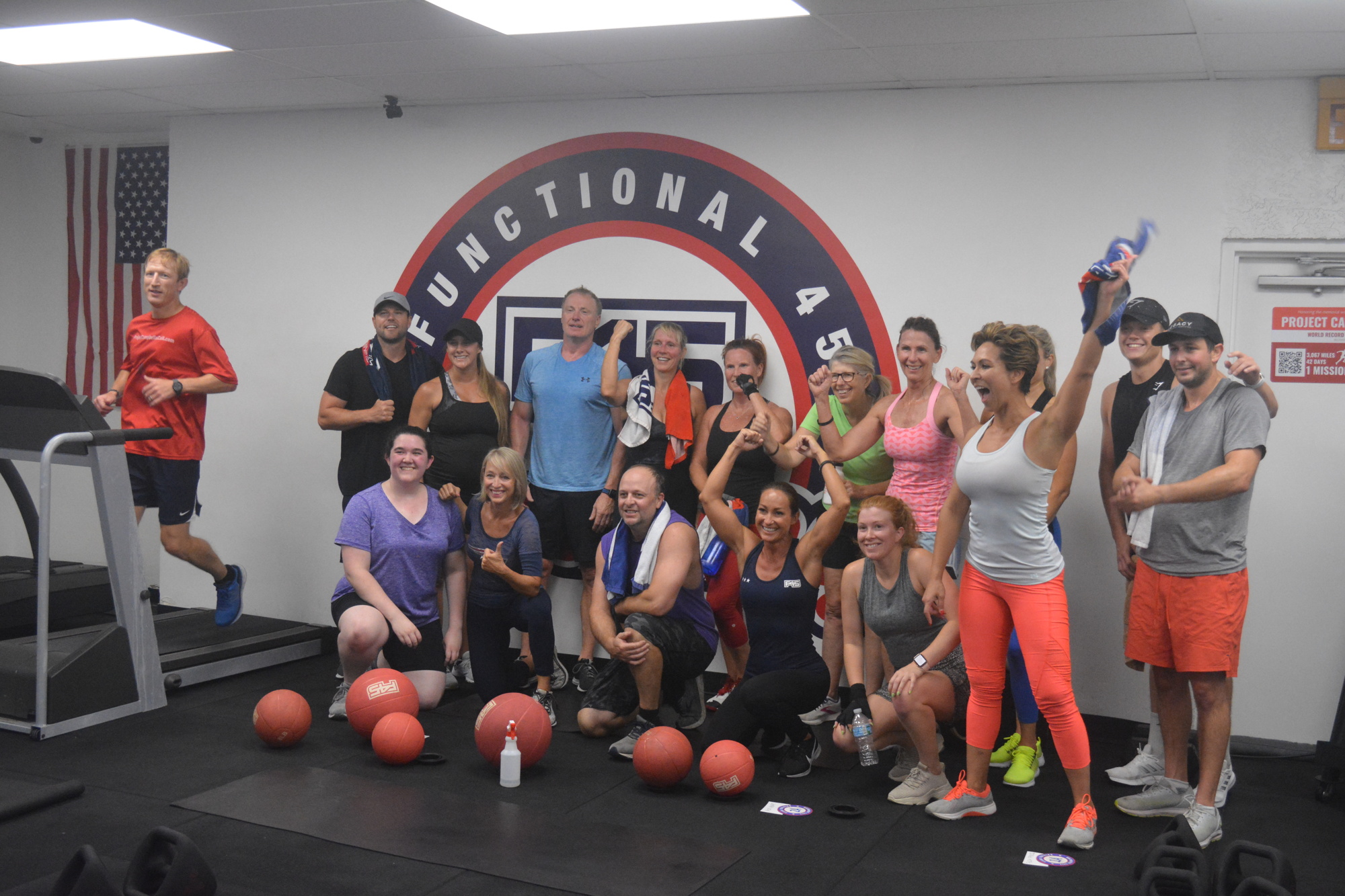 An F45 Training class poses with Nels Matson after the class's 9 a.m. workout on April 22. The class came to work out with Matson as he completed his 14-hour treadmill run as part of his training to break the cross-country record.