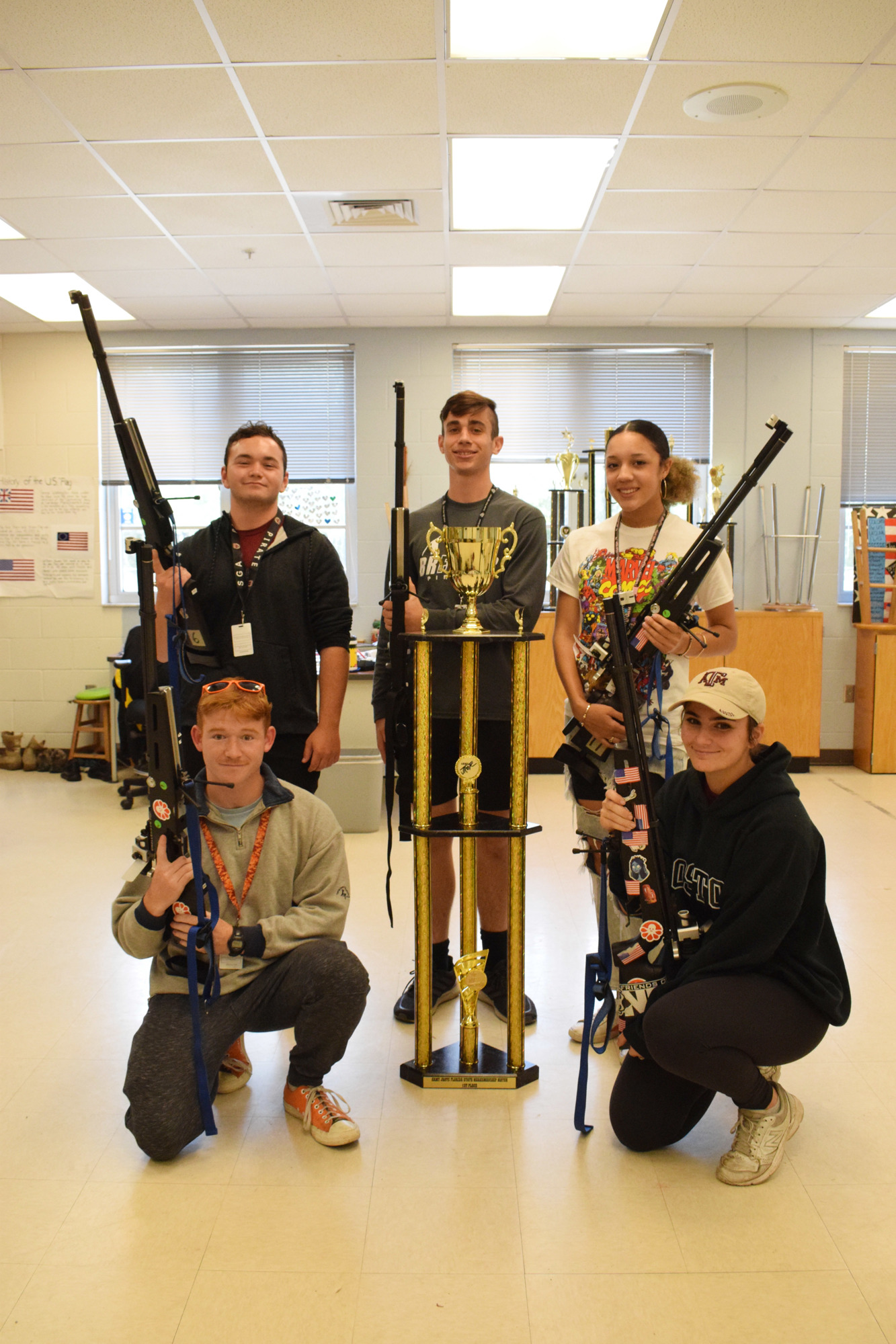 Braden River High School JROTC rifle team members Stuart Macaulay, Christian Bell, Nathan Walmsley, Adanna Wharton and Elayna Andrews celebrate their state championship title.