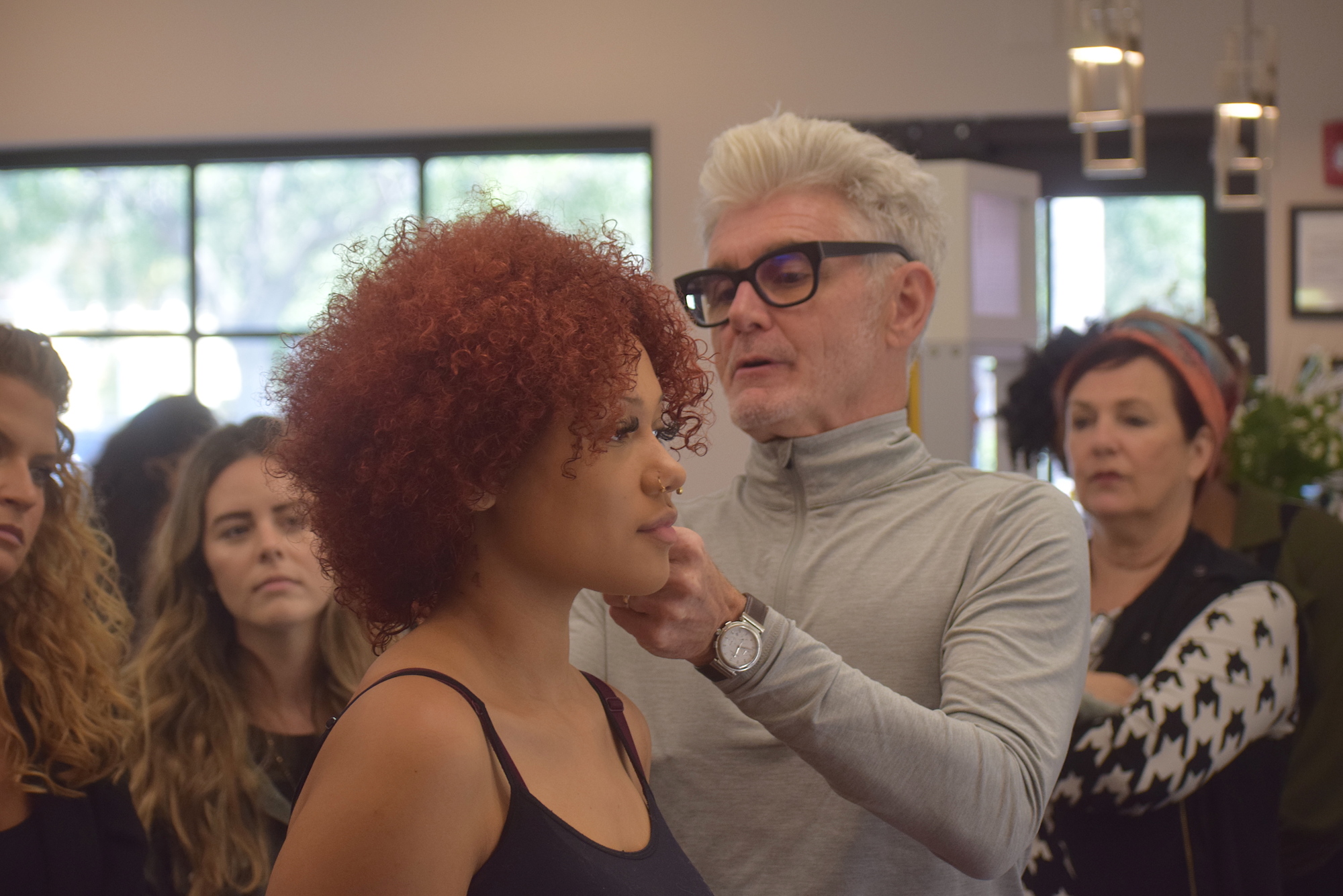 Yellow Strawberry stylist Willow Sanders acts as a model for Stephen Moody as he passes along his four decades of hair cutting knowledge.