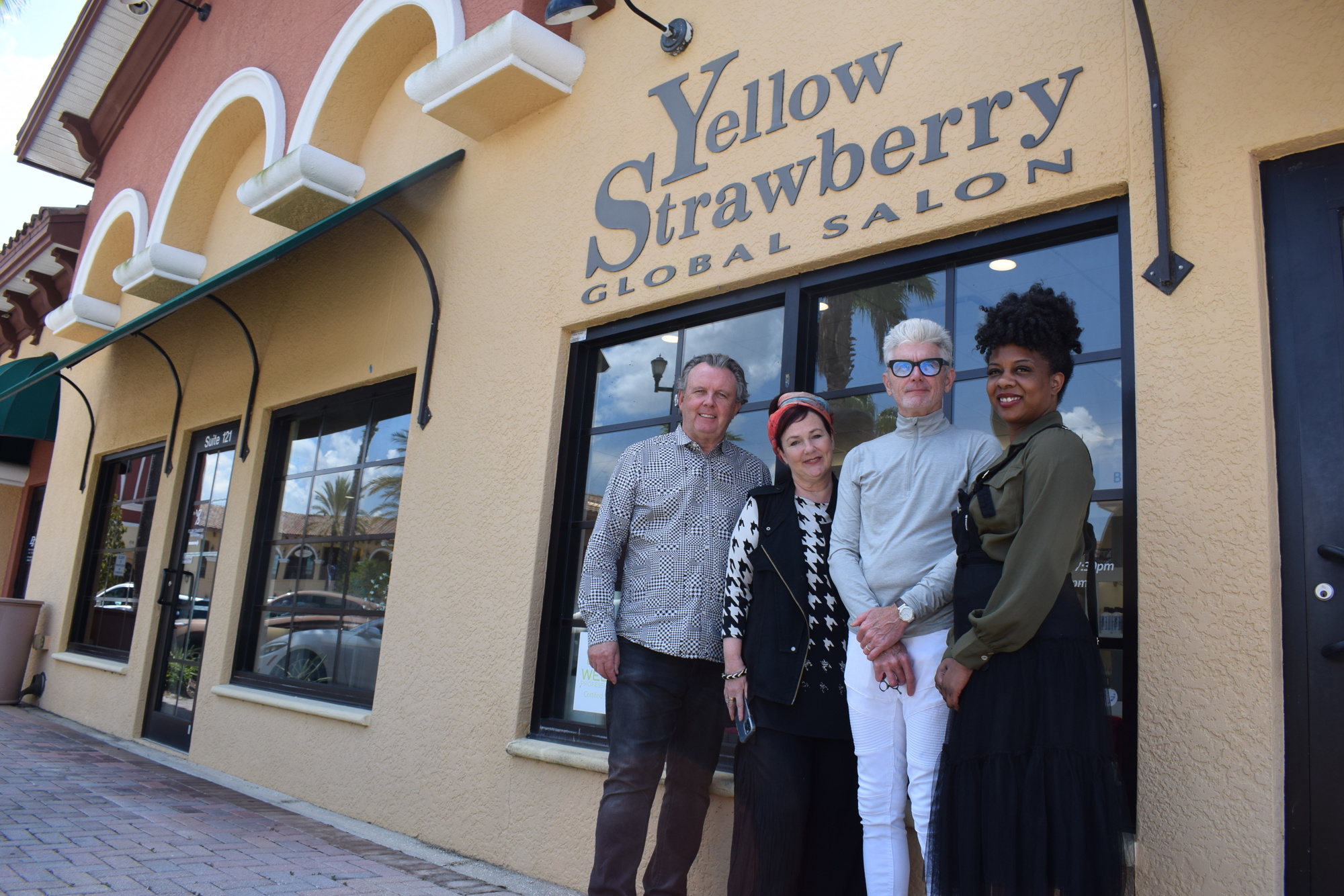 Owners Desmond and Caroline Behan stand outside their Lakewood Ranch salon with Stephen Moody and Wella Brand Educator Johannie Jacquitte.