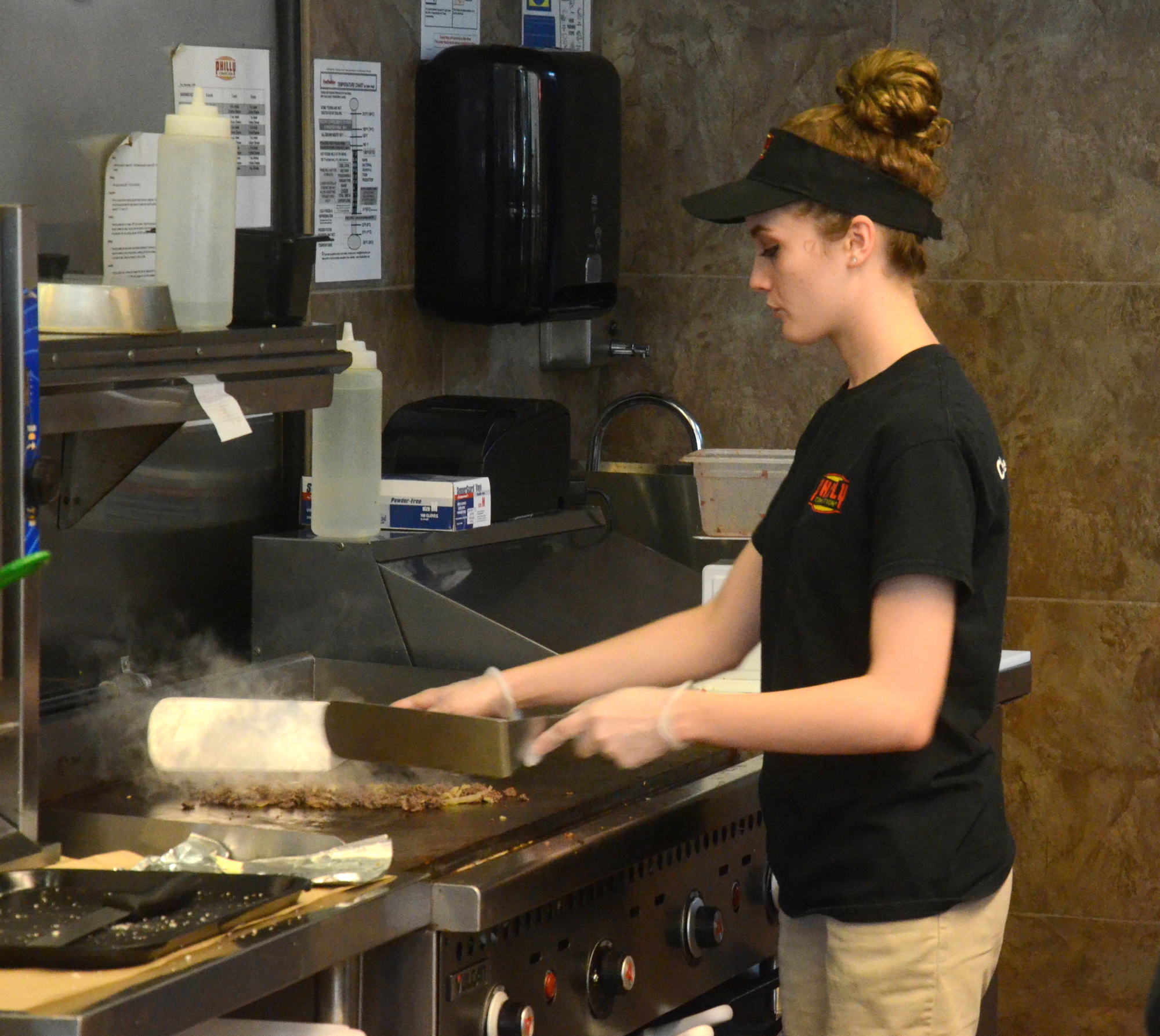 The staff at Philly Connection in Ocoee loves making a great cheesesteak for customers.