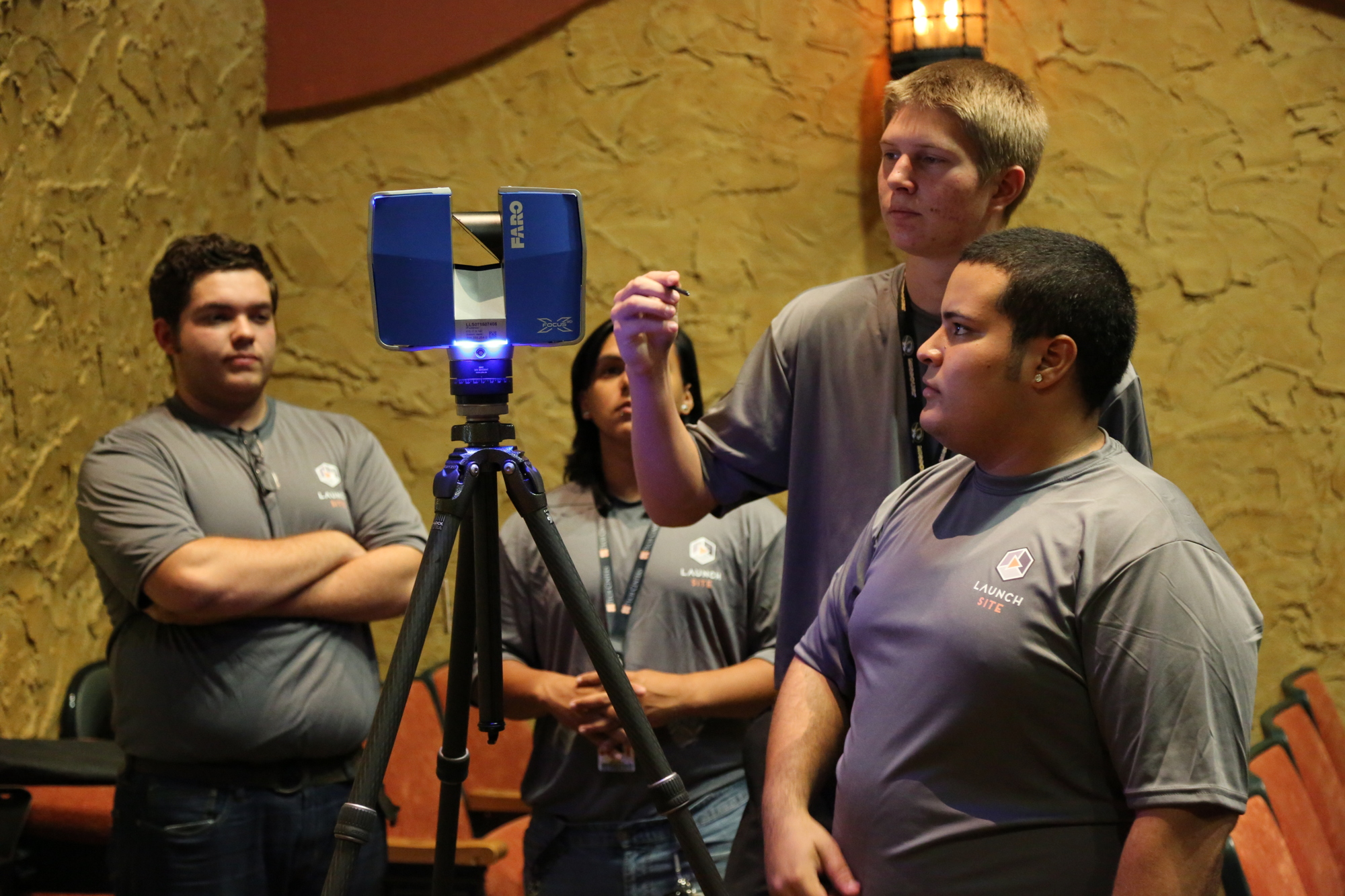 Dante Colombo, Robert Flint, Andrew Fowler and Miguel Quinones use the FARO Focus 3D to scan the theater.
