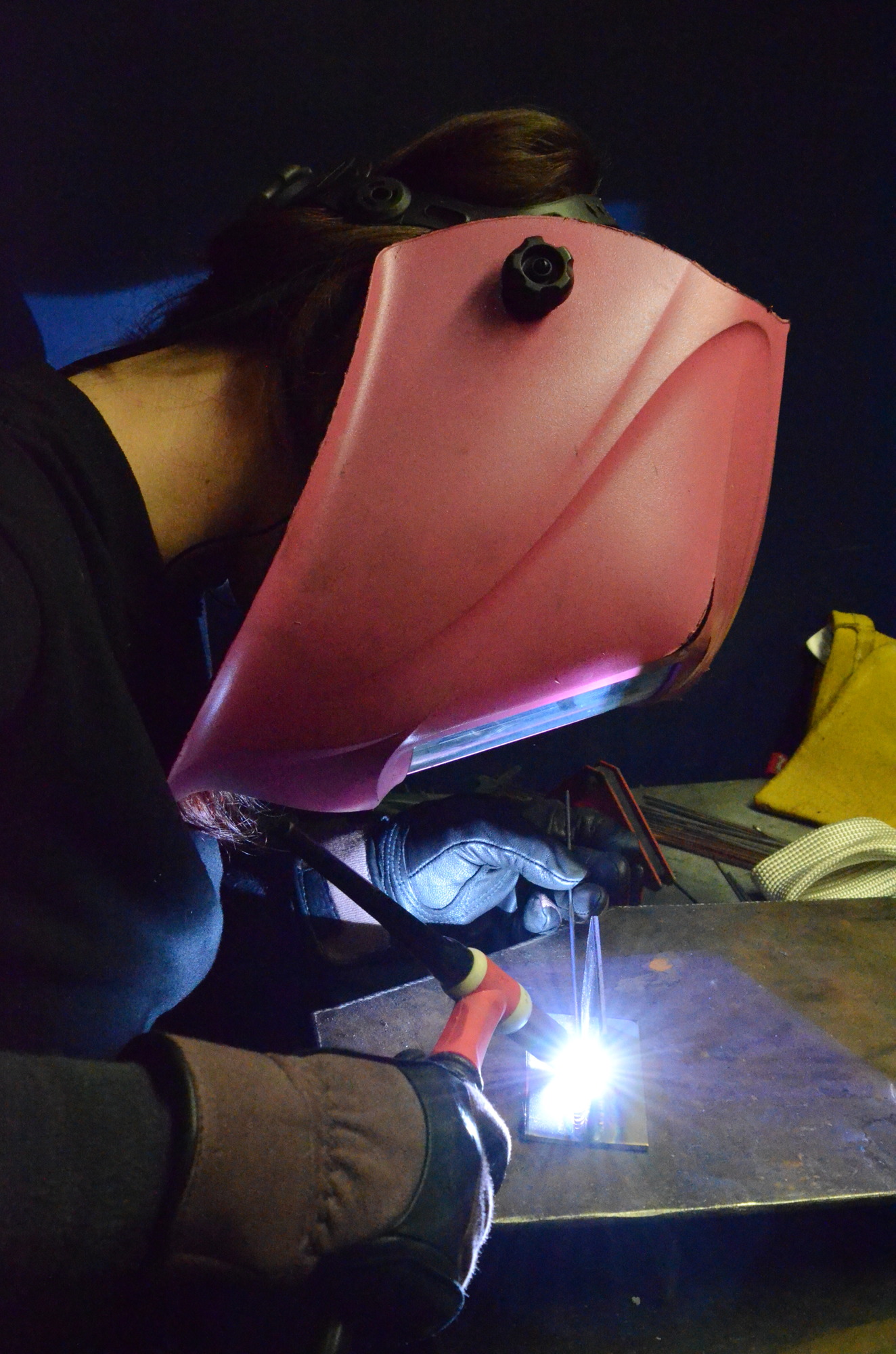 Madeline Slater, who will graduate from Westside College's welding course in May, performs the TIG (tungsten inert gas) welding method.