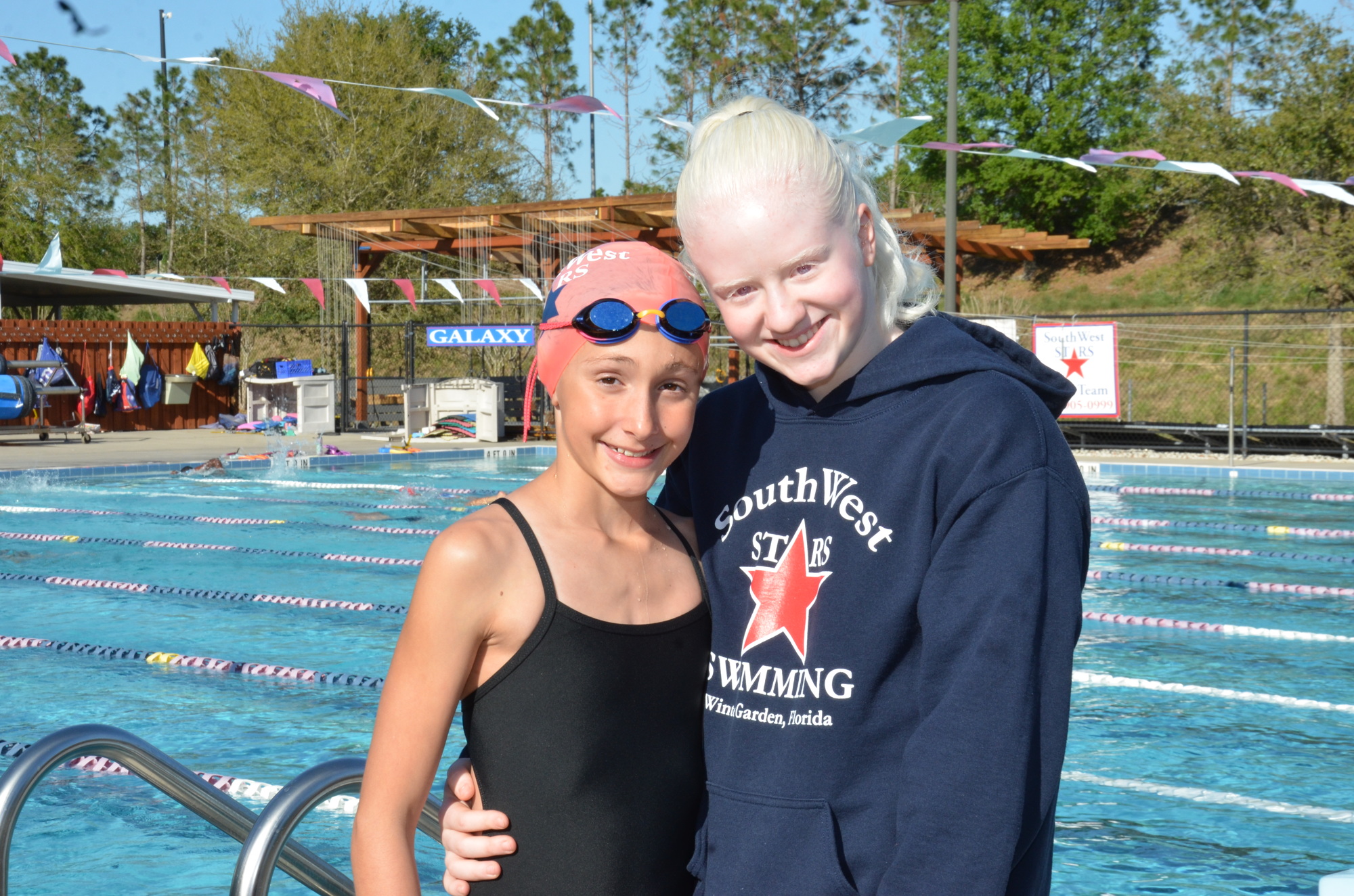 Ella Klyce, left, and Marcela Scaramuzza were among the individual champions for the SouthWest STARS at the Florida Age Group Championships.