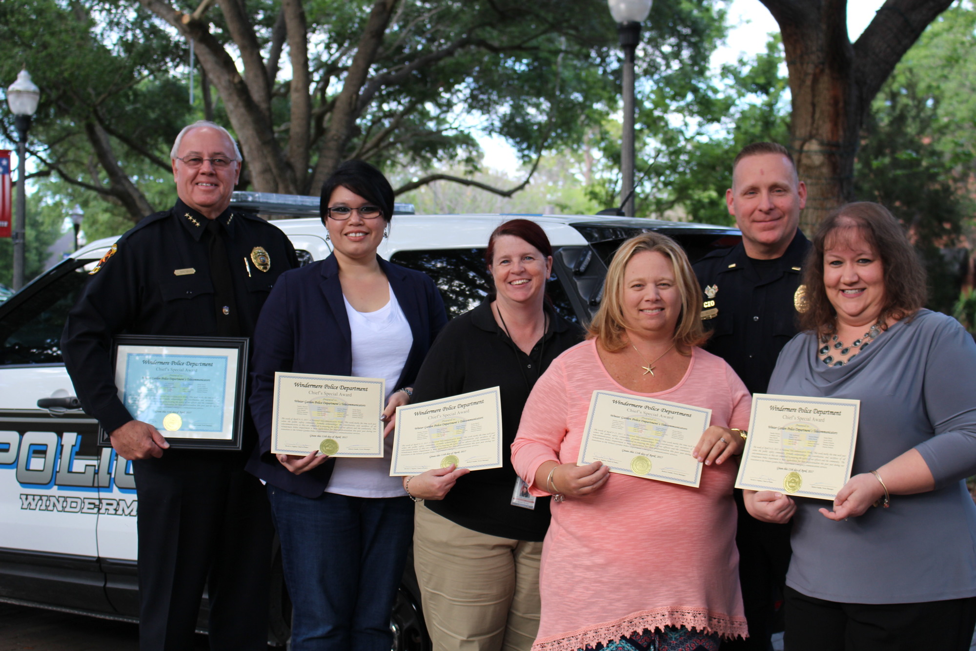 WG Police Chief George Brennan and WG Police Lt. Scott Allen with 911 dispatchers Melissa Oehler, Susan Burns, Julie Anderson and Melissa McCarthy, who received certificates of appreciation from the Town of Windermere.