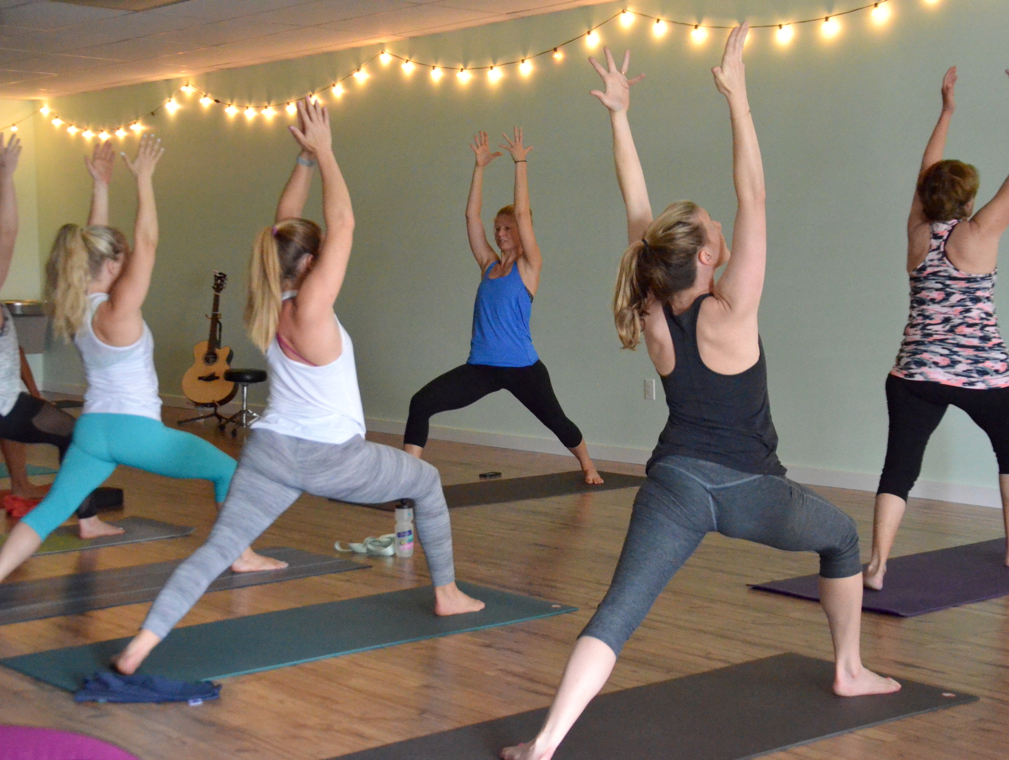 Holly Garrison leads a Sunday morning class at Firefly Yoga in Ocoee.