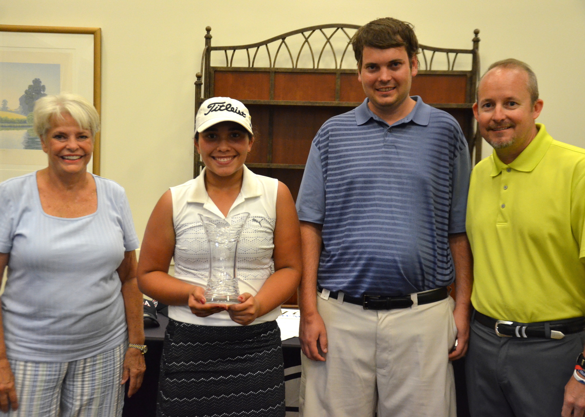 Apopka’s Izzy Pellot, 12, won the Girls Division and is pictured with members of the Bell family.