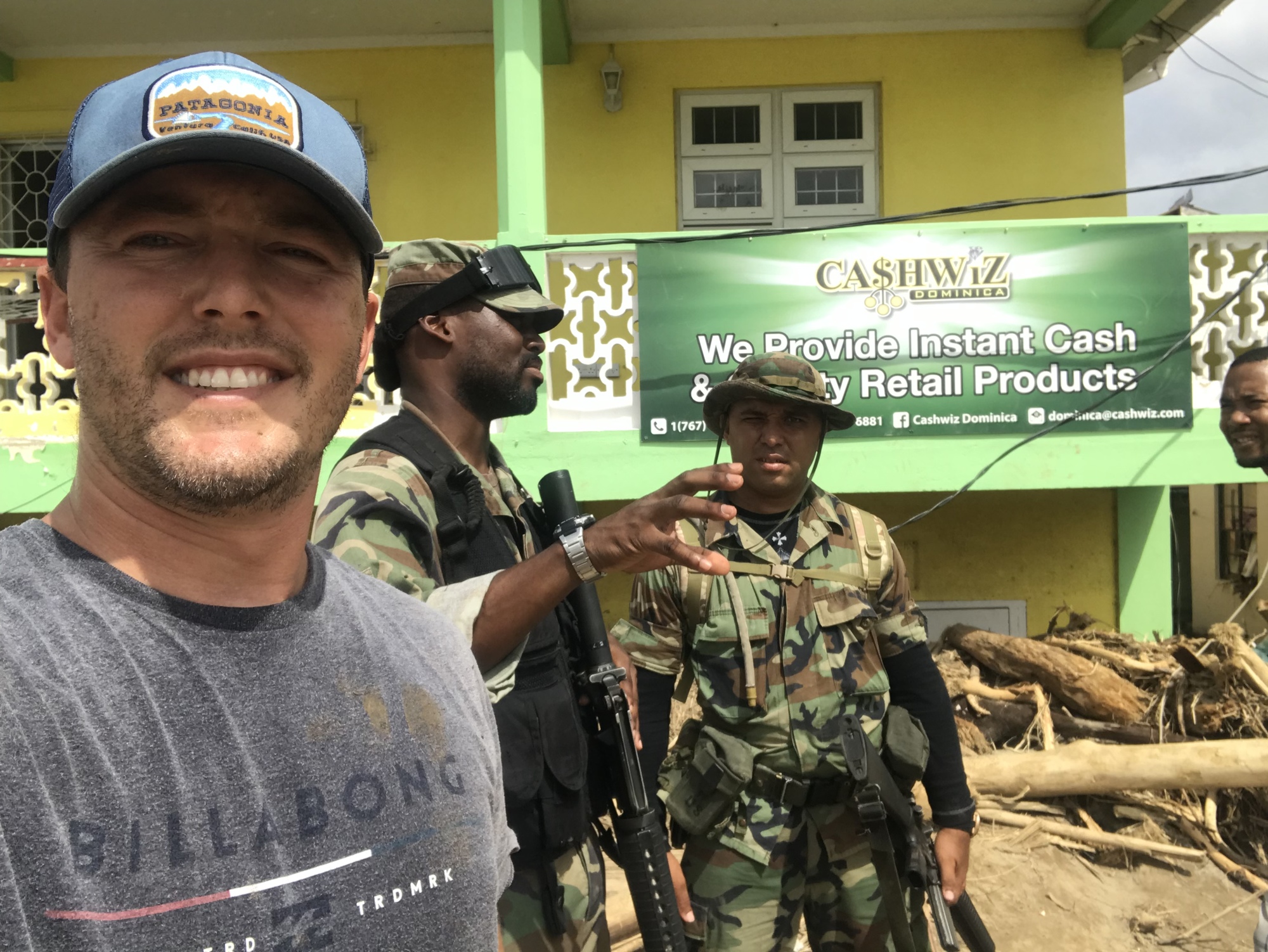 Windermere resident Chad McGhee with some of the military officers patrolling Dominica.