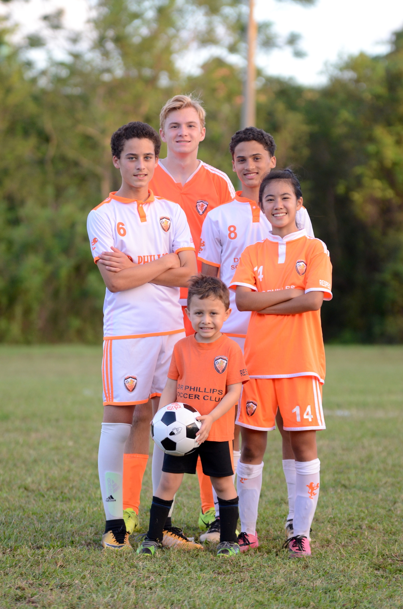Neemias Cordeiro, left, Nicholas DeFreitas, Rafael Guerrero, Sakura Nagakubo and Sebastian Navarro (front) all love playing for Dr. Phillips Soccer Club.