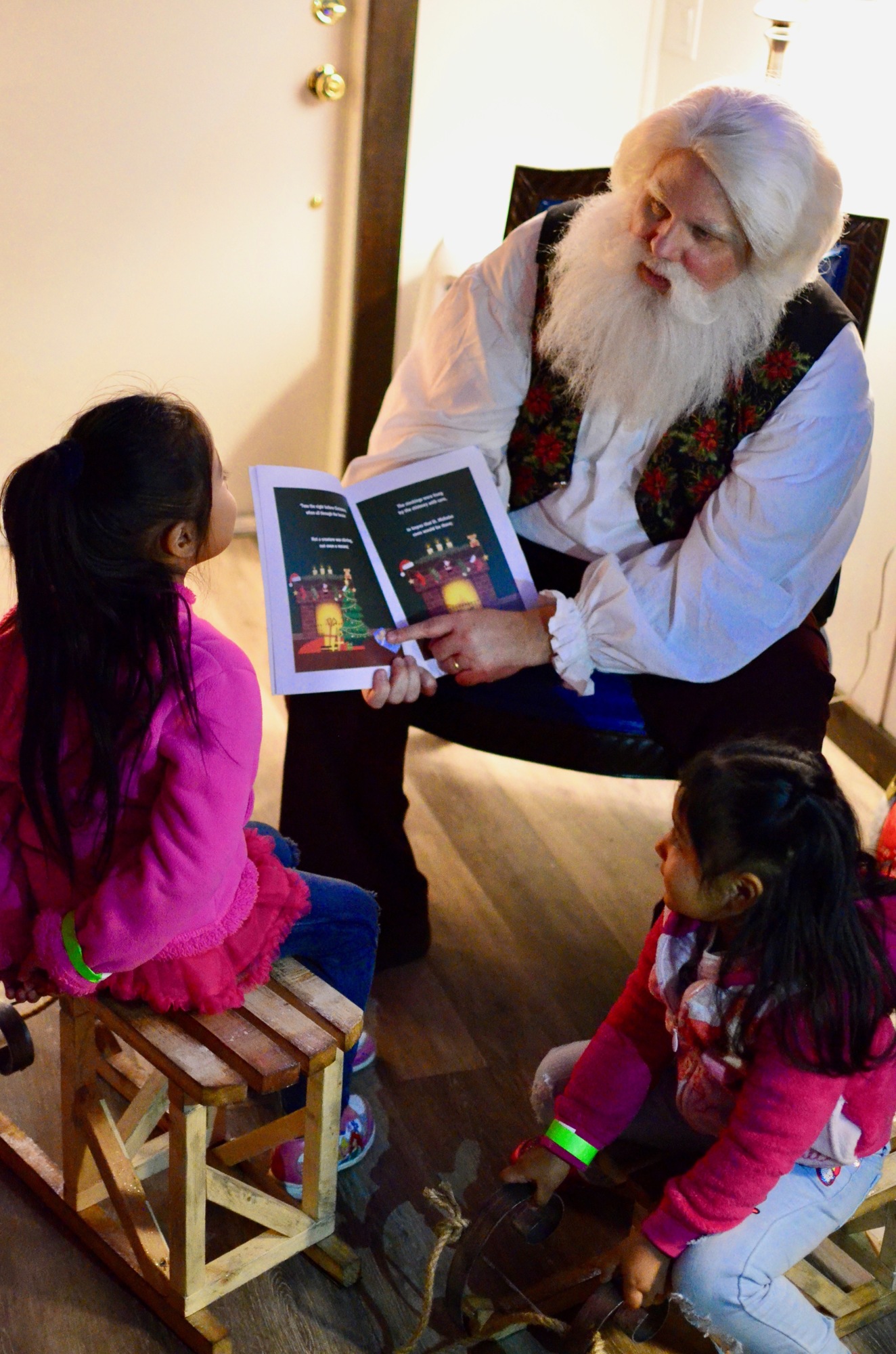 Santa Claus is happy to share stories with his visitors.