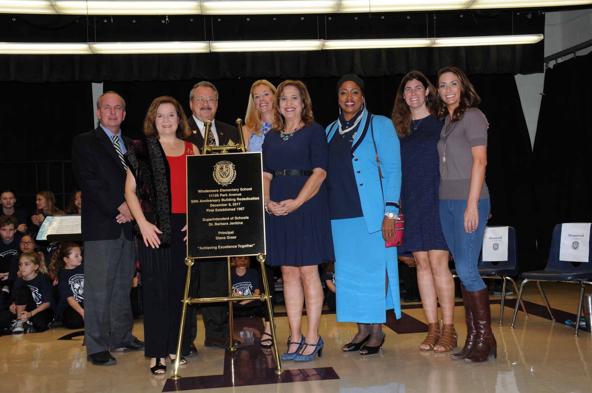 Windermere Elementary received a plaque celebrating the rededication of the school. With the marker are Greg Moody, Pam Gould, Gary Bruhn, Michaal Rossi, Diana Greer, Ethel Wellington-Trawick, Judy Paulsen and Dean Malley.
