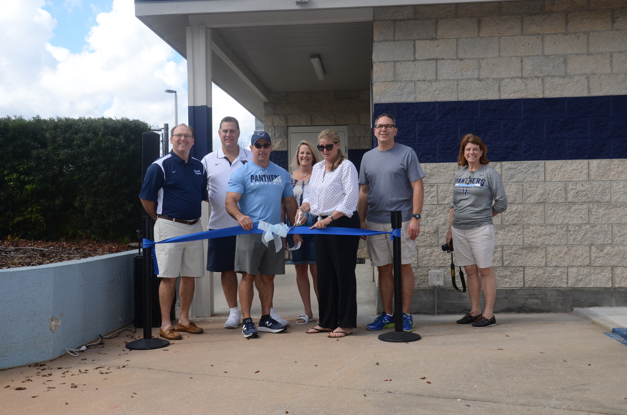 Board members of the DPHS Baseball Facility Foundation cut the ribbon on the new locker room.