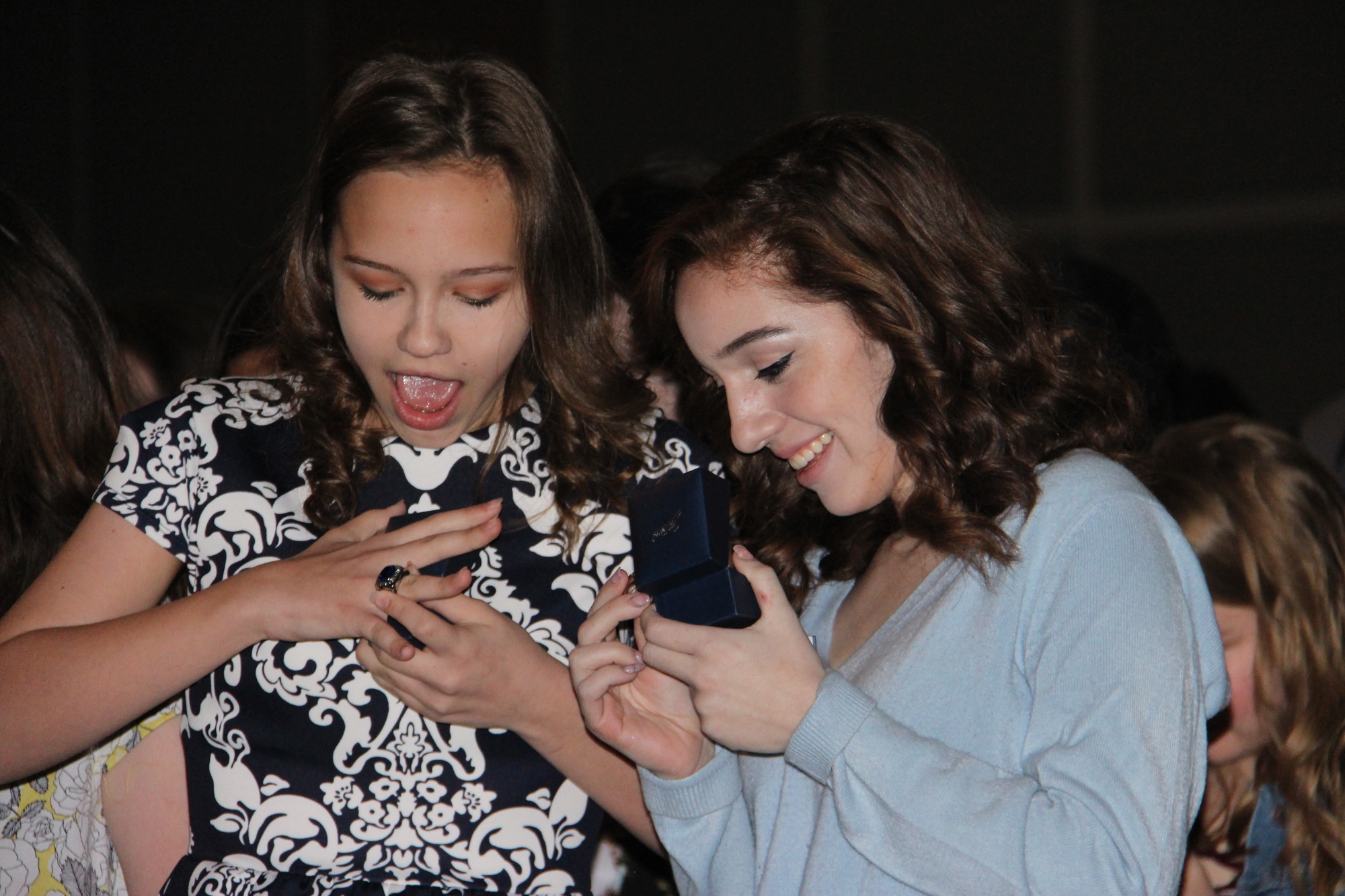 Peyton Brown, left, and Isabella Bruno smiled with delight as they tried on their rings.