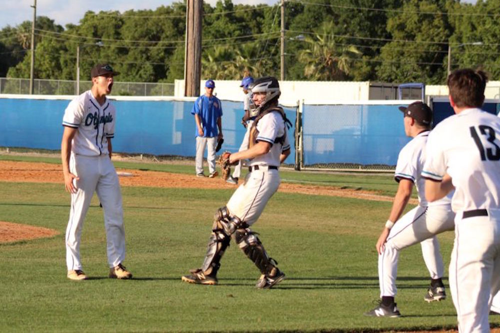 Jeslyn Whitehead celebrates after getting the final out against the Warriors. Photo by Nate Marrero.