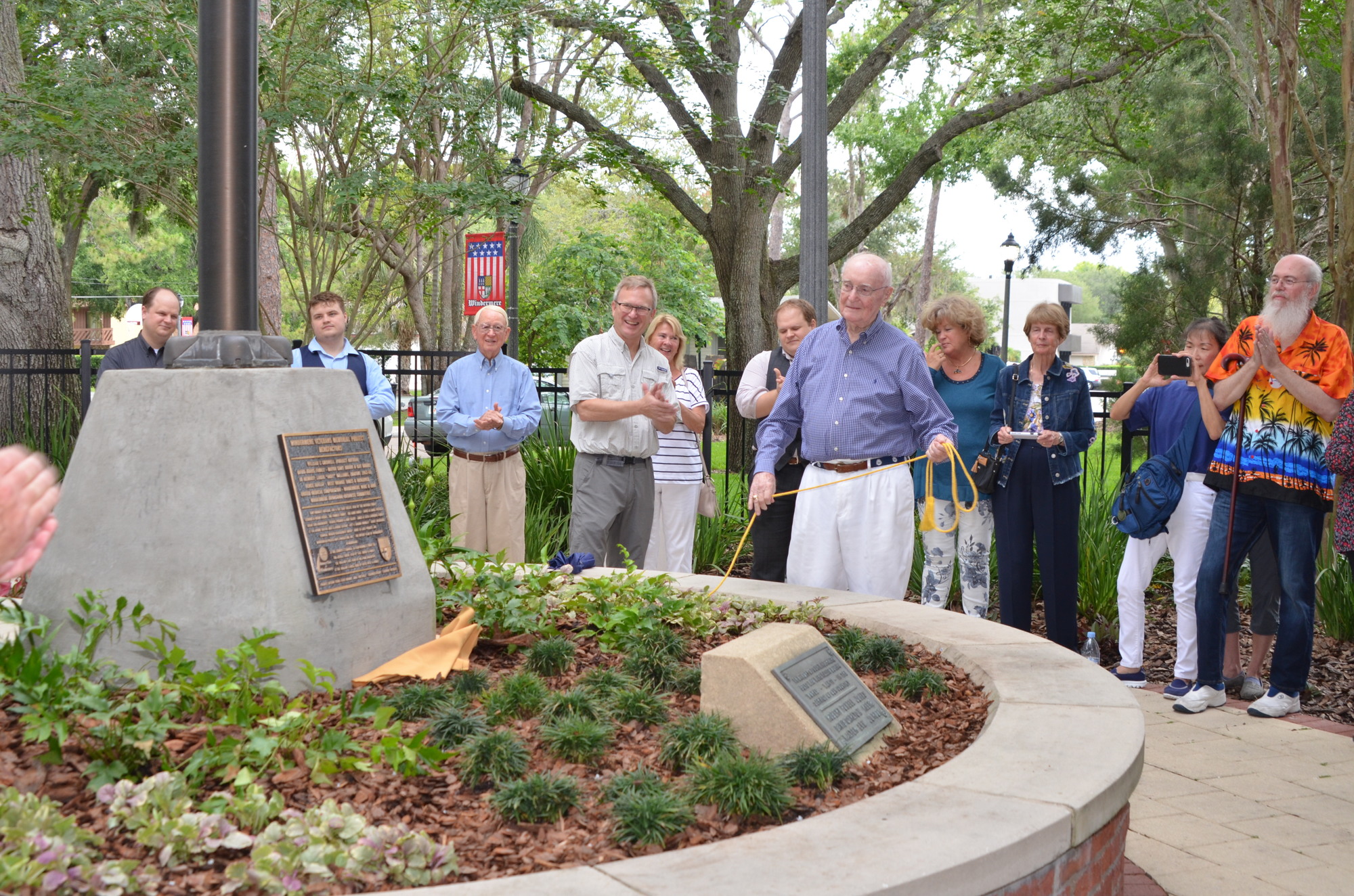 Bill Criswell unveils the benefactors plaque for the Windermere Veterans Memorial project.