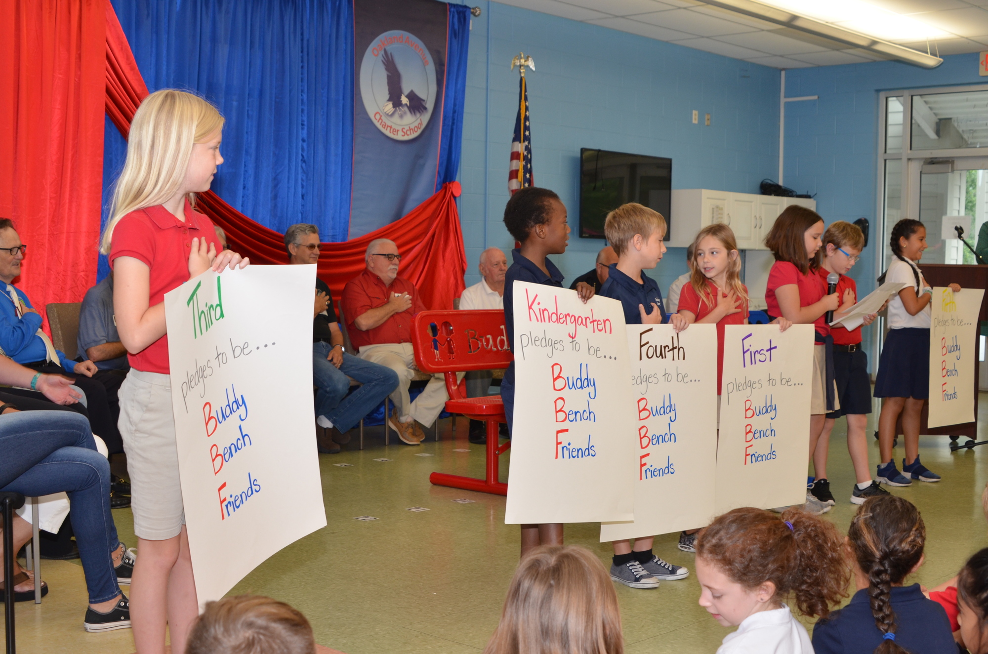 Students take the pledge to follow the rules of the Buddy Benches.