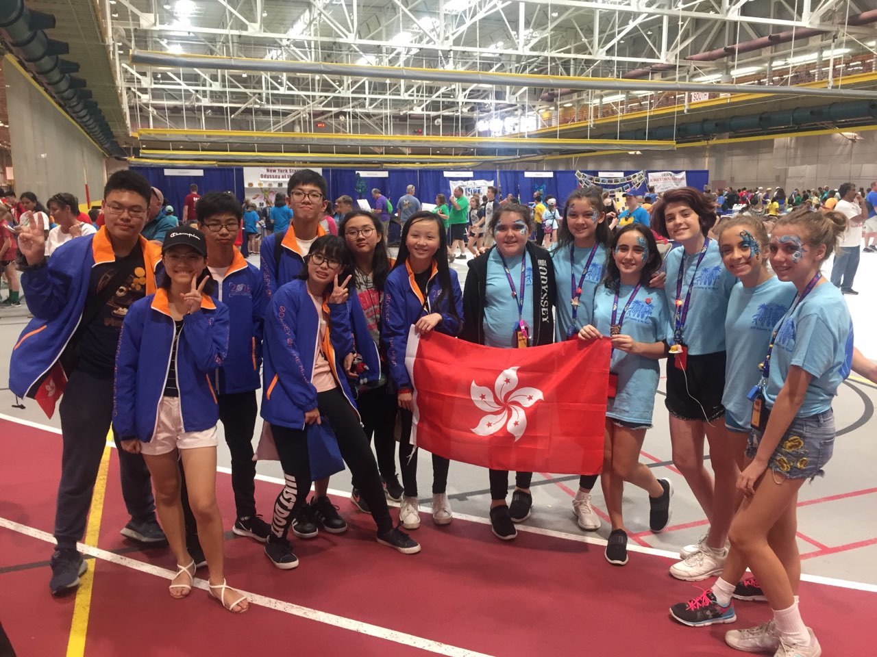 The Holy Family Odyssey of the Mind team, right, spent time with its buddy team from Hong Kong at the world championships in Iowa.