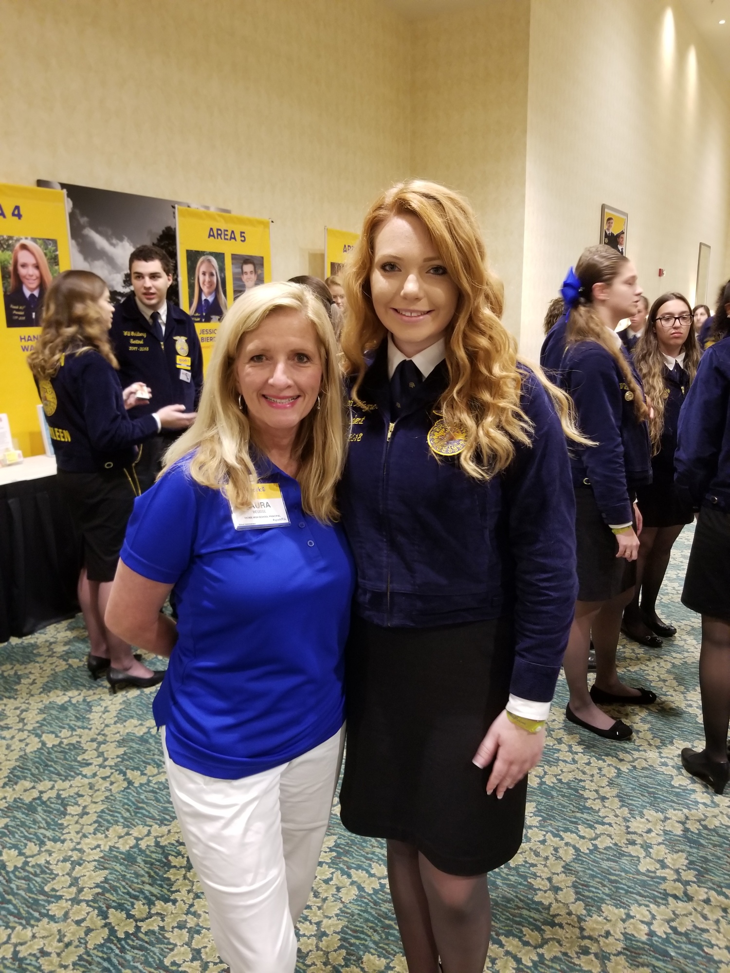Ocoee High School Principal Laura Beusse congratulates Hannah Wagner after the OHS graduate wins the position of state FFA vice president.
