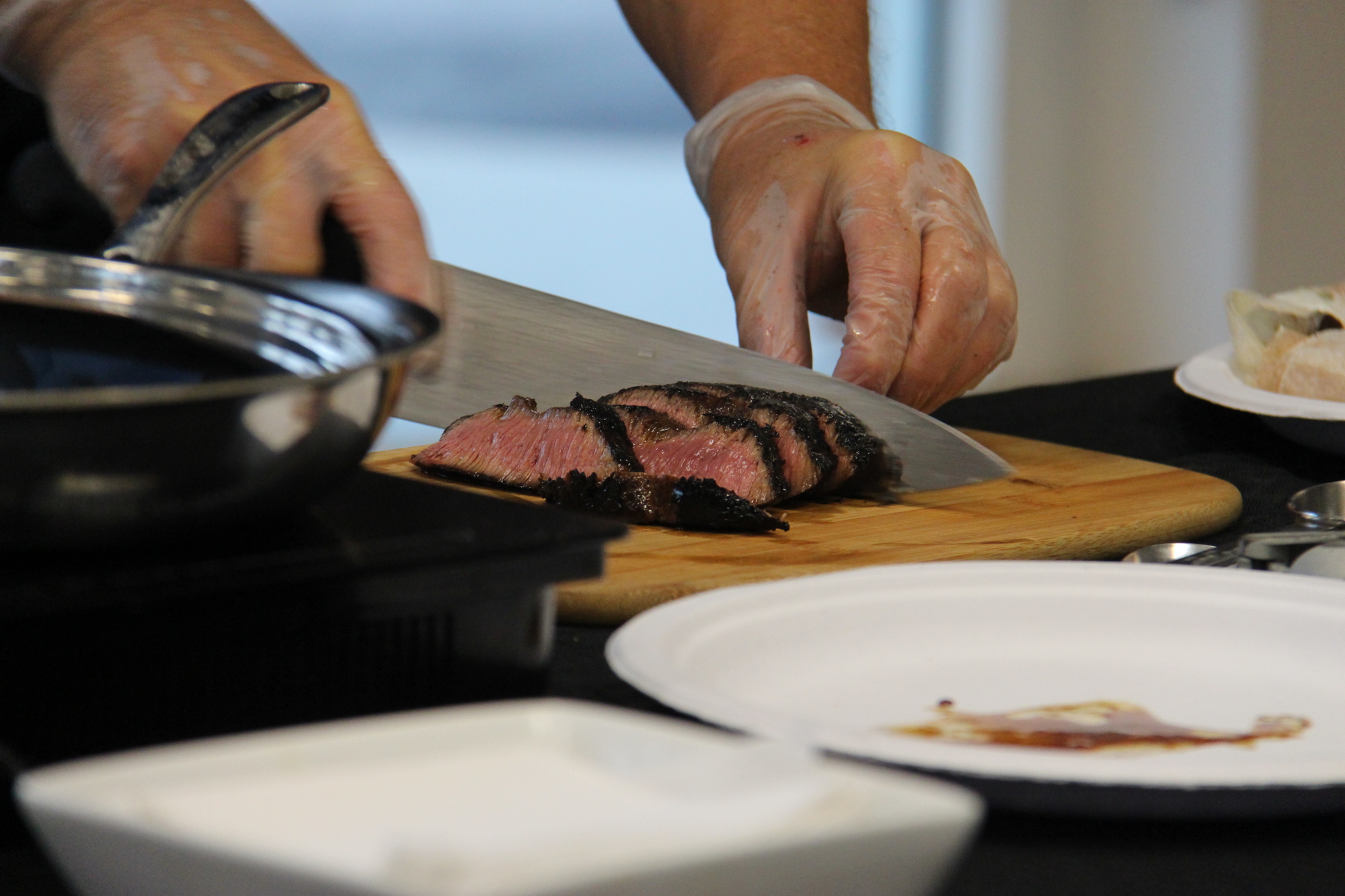Chef Warren Caterson plated a medium-rare steak after giving a live cooking demonstration.