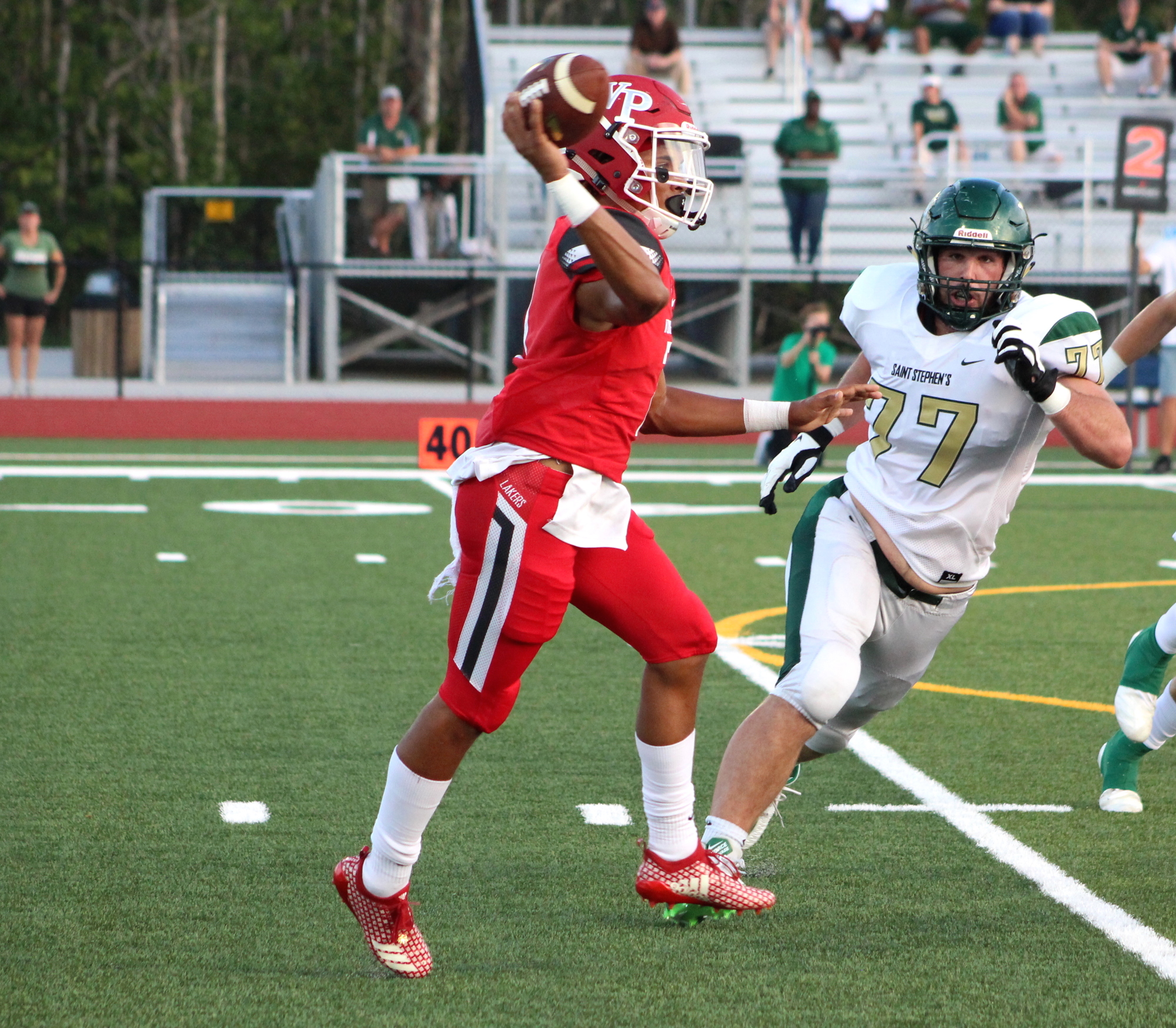 Windermere Prep quarterback Kai Patterson tossed two touchdowns and ran for another. Photo by Chris Mayer