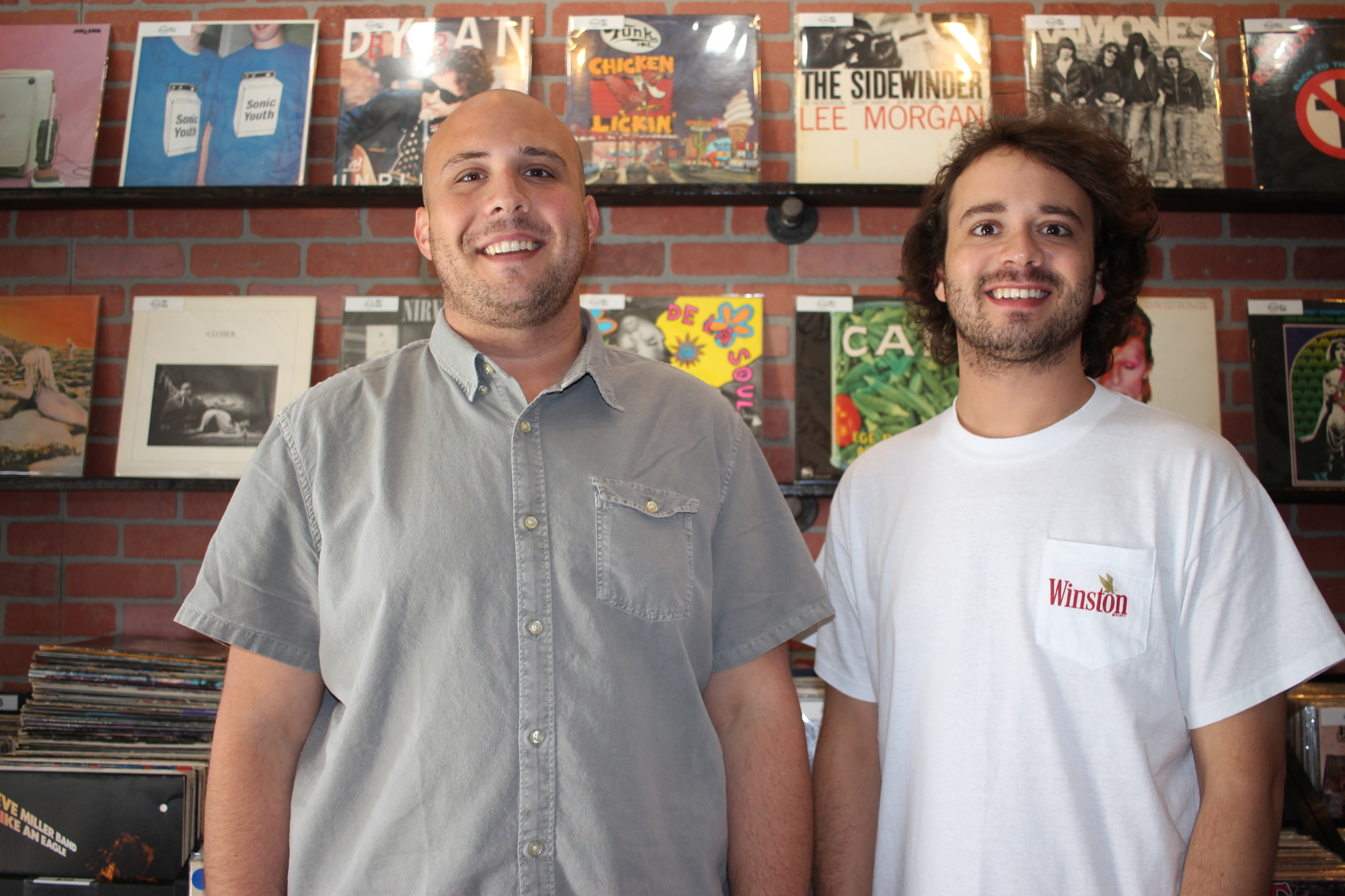Alex Cohen, left, and his brother, Peter, are the co-owners of Foundation College Park, a shop that sells vinyl and vintage clothes.