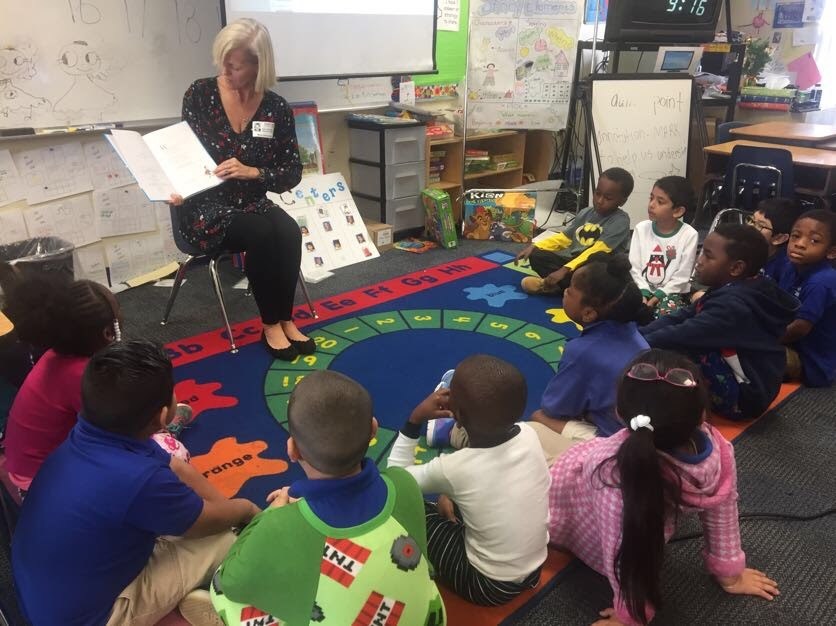 Kari Schmitz reads to kindergarten students at Maxey Elementary.