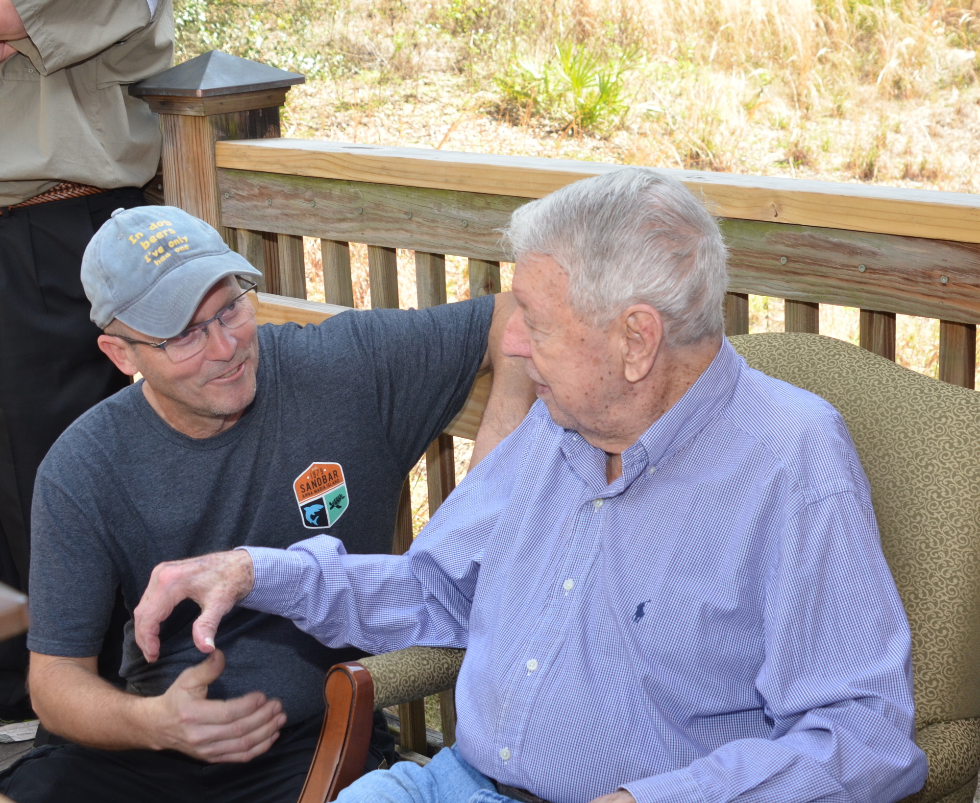 Jim Peterson, left,  president of Friends of Lake Apopka, was one of many who congratulated Jim Thomas.