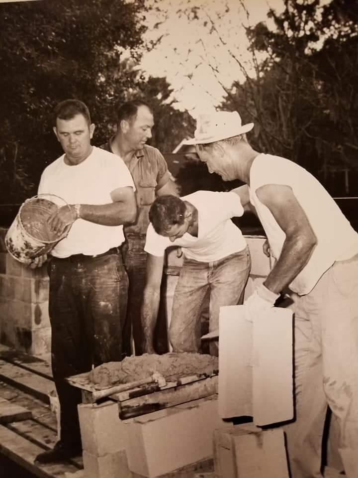 Frog Vandergrift, left, assists in the building of the city of Ocoee’s first fire station on West McKey Street.
