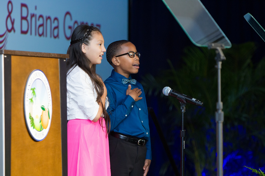 Two students from the Boys and Girls Clubs' West Orange Branch led the Pledge of Allegiance.